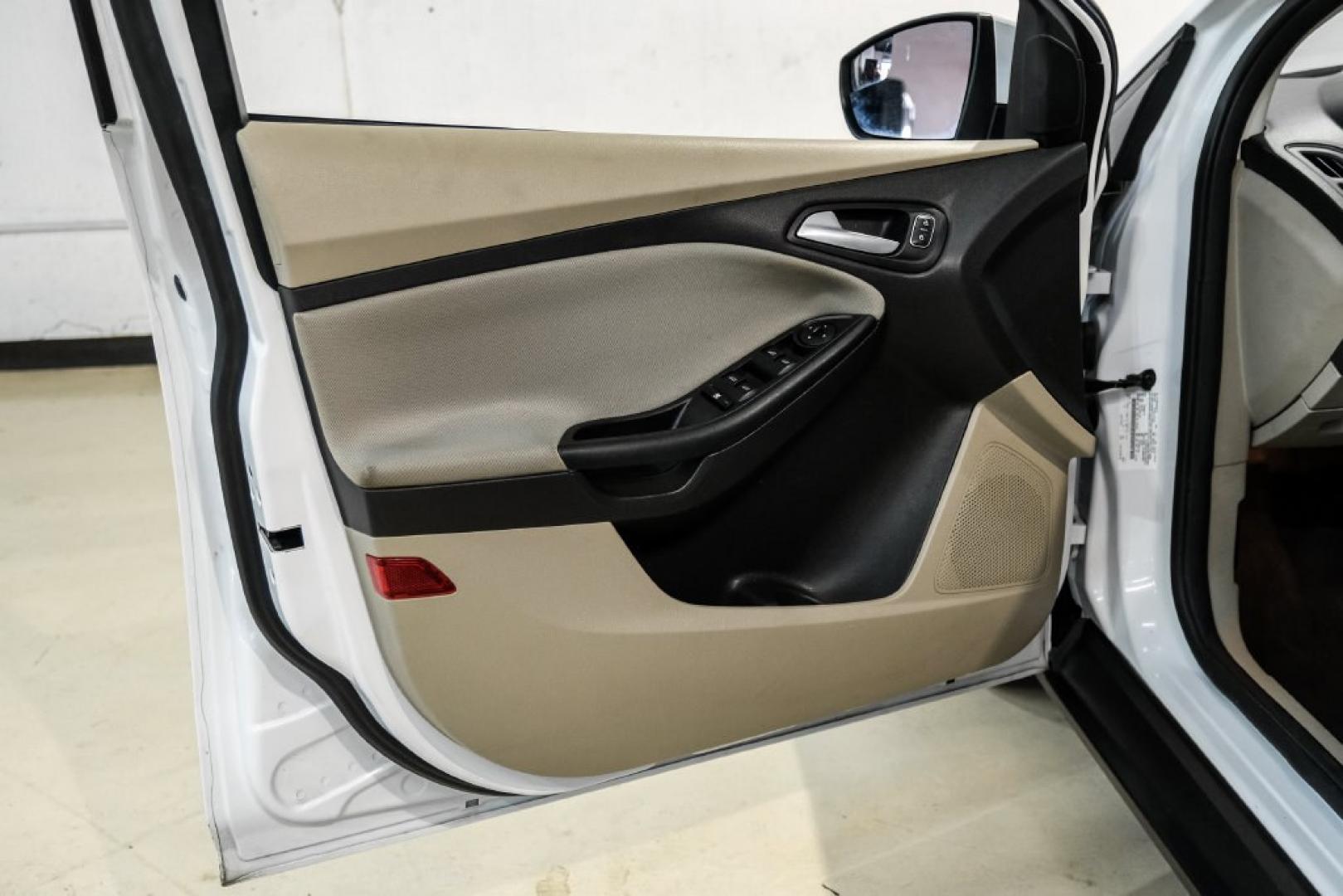 2017 Oxford White /Medium Light Stone Ford Focus SE (1FADP3FE0HL) with an EcoBoost 1.0L I3 GTDi DOHC Turbocharged VCT engine, Automatic transmission, located at 15300 Midway Rd., Addison, TX, 75001, (972) 702-0011, 32.958321, -96.838074- Photo#40