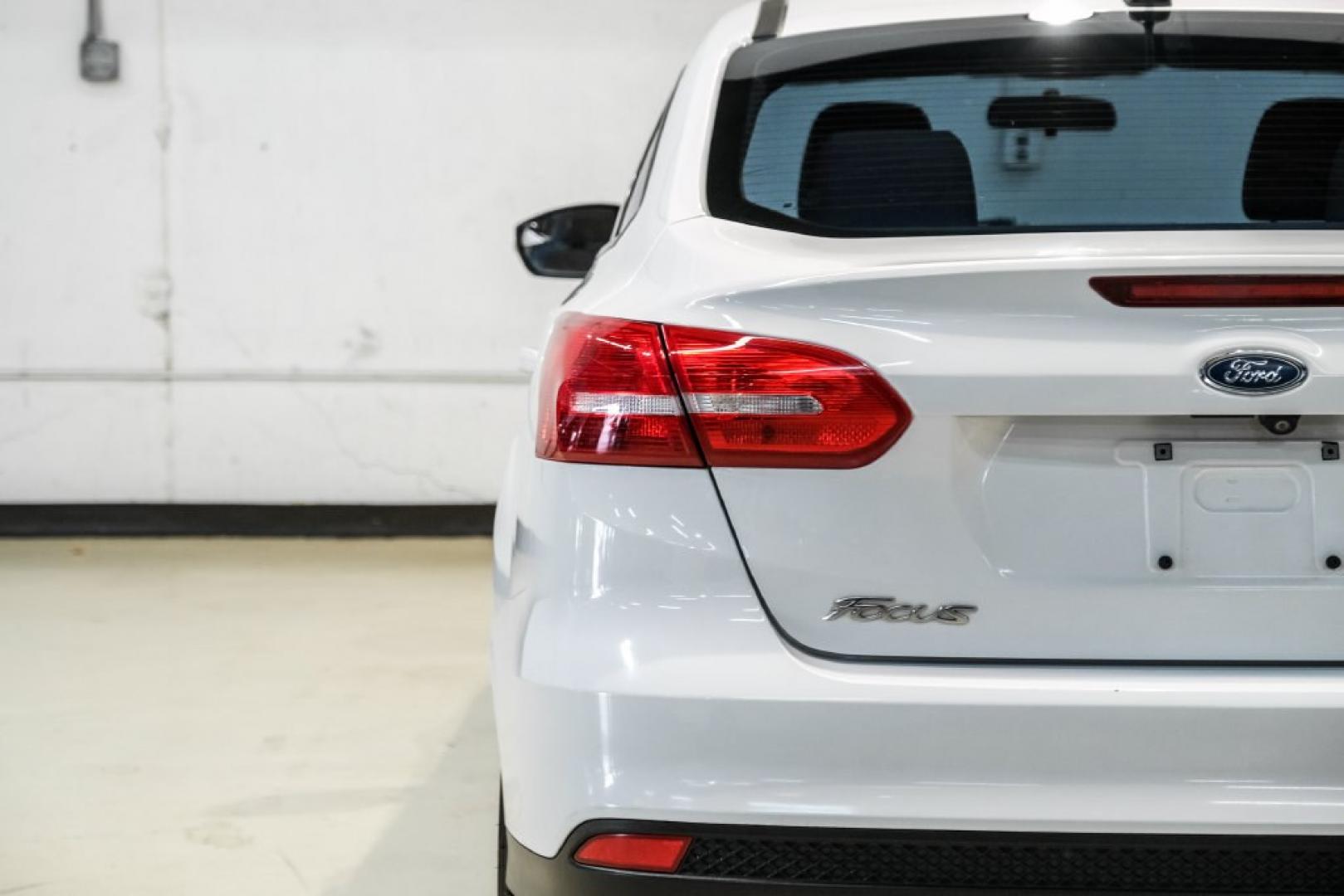 2017 Oxford White /Medium Light Stone Ford Focus SE (1FADP3FE0HL) with an EcoBoost 1.0L I3 GTDi DOHC Turbocharged VCT engine, Automatic transmission, located at 15300 Midway Rd., Addison, TX, 75001, (972) 702-0011, 32.958321, -96.838074- Photo#46