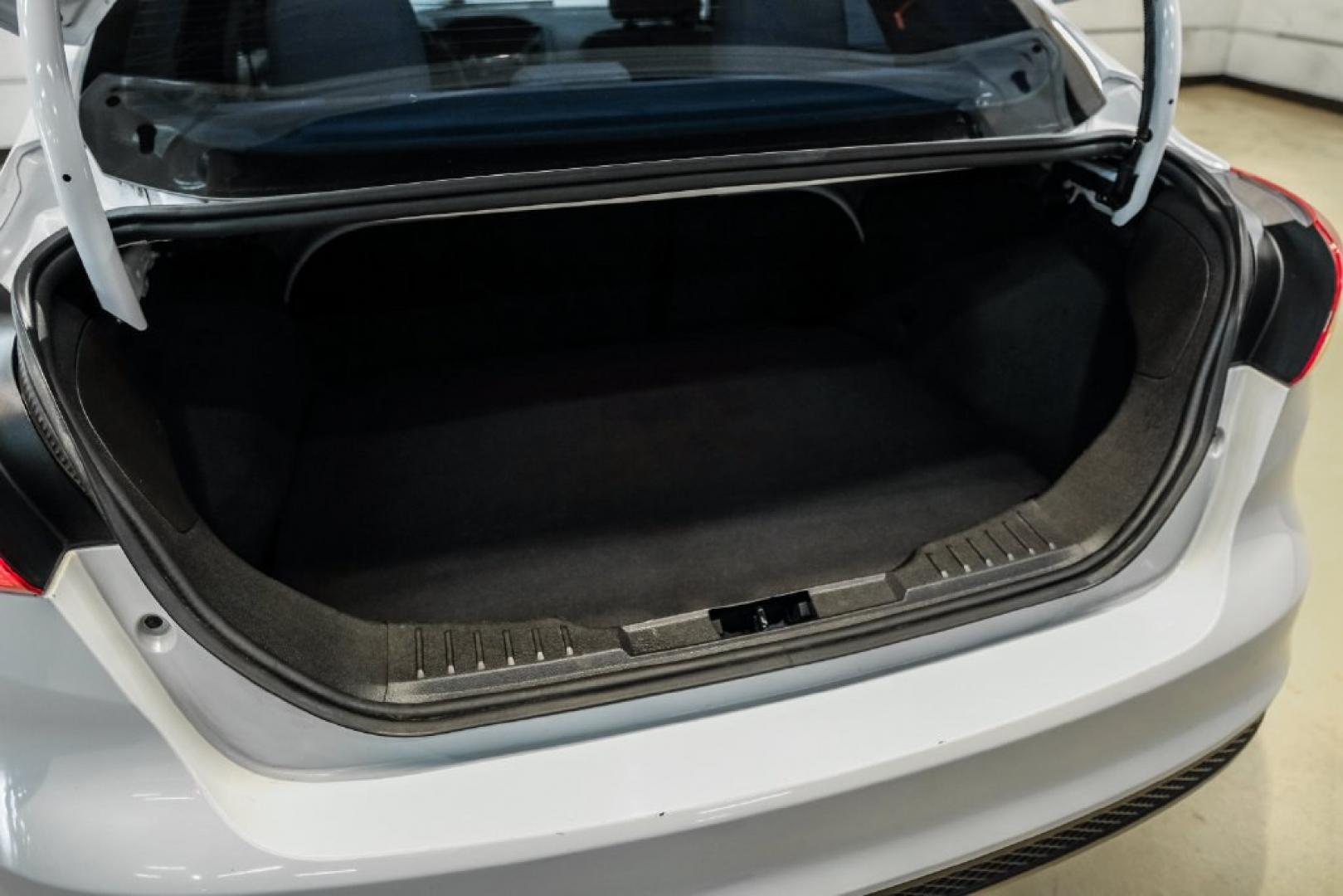 2017 Oxford White /Medium Light Stone Ford Focus SE (1FADP3FE0HL) with an EcoBoost 1.0L I3 GTDi DOHC Turbocharged VCT engine, Automatic transmission, located at 15300 Midway Rd., Addison, TX, 75001, (972) 702-0011, 32.958321, -96.838074- Photo#51