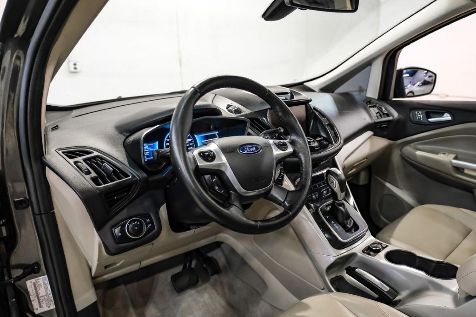 2015 Magnetic /Medium Light Stone Ford C-Max Energi SEL (1FADP5CUXFL) with an I4 Hybrid engine, CVT transmission, located at 15300 Midway Rd., Addison, TX, 75001, (972) 702-0011, 32.958321, -96.838074- Photo#2