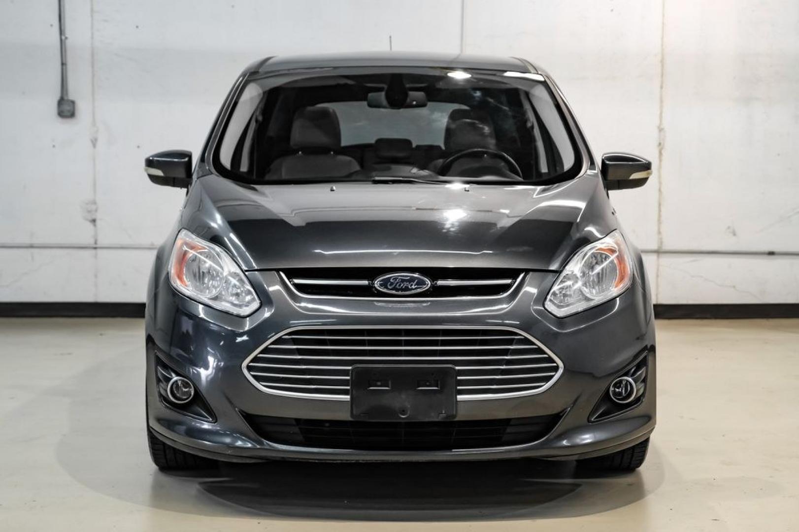 2015 Magnetic /Medium Light Stone Ford C-Max Energi SEL (1FADP5CUXFL) with an I4 Hybrid engine, CVT transmission, located at 15300 Midway Rd., Addison, TX, 75001, (972) 702-0011, 32.958321, -96.838074- Photo#5