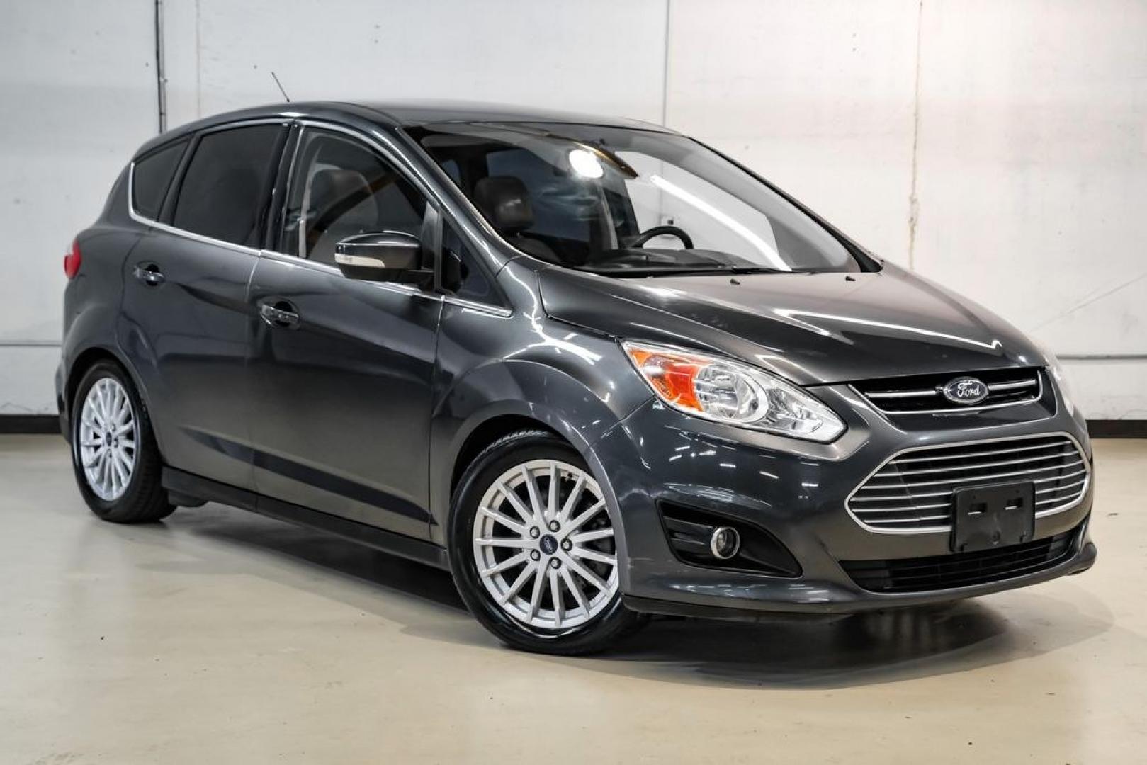 2015 Magnetic /Medium Light Stone Ford C-Max Energi SEL (1FADP5CUXFL) with an I4 Hybrid engine, CVT transmission, located at 15300 Midway Rd., Addison, TX, 75001, (972) 702-0011, 32.958321, -96.838074- Photo#6