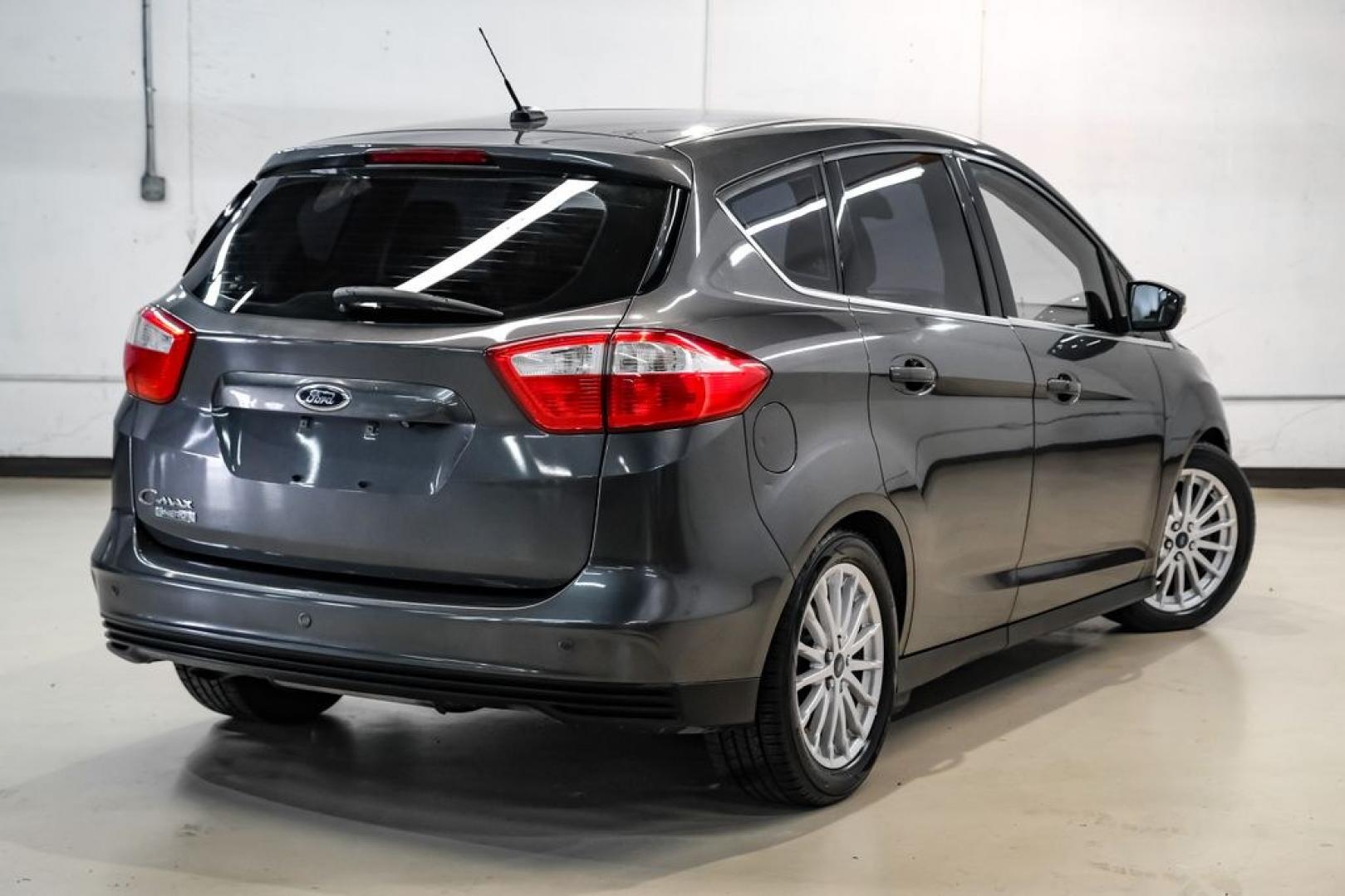 2015 Magnetic /Medium Light Stone Ford C-Max Energi SEL (1FADP5CUXFL) with an I4 Hybrid engine, CVT transmission, located at 15300 Midway Rd., Addison, TX, 75001, (972) 702-0011, 32.958321, -96.838074- Photo#8