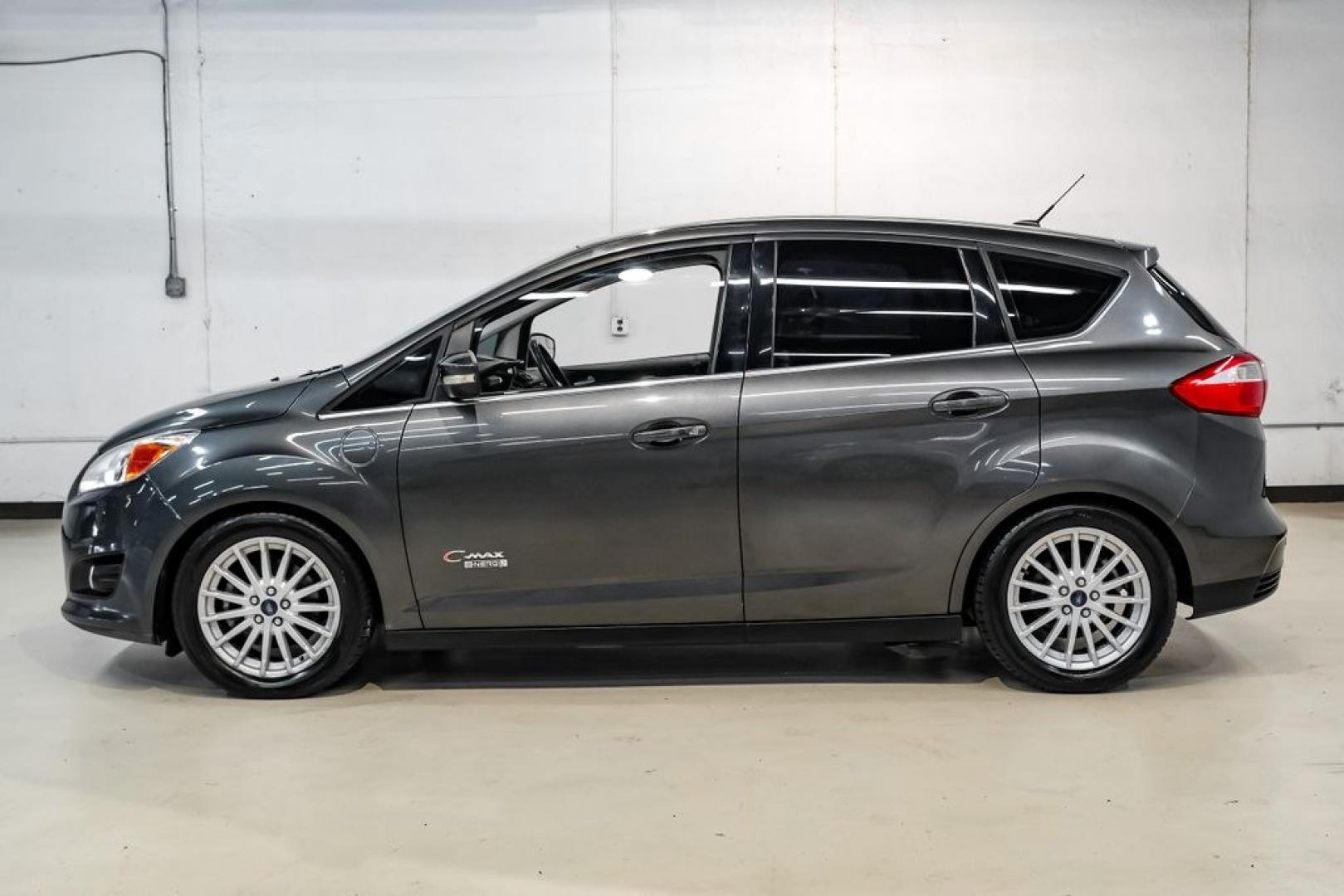 2015 Magnetic /Medium Light Stone Ford C-Max Energi SEL (1FADP5CUXFL) with an I4 Hybrid engine, CVT transmission, located at 15300 Midway Rd., Addison, TX, 75001, (972) 702-0011, 32.958321, -96.838074- Photo#11