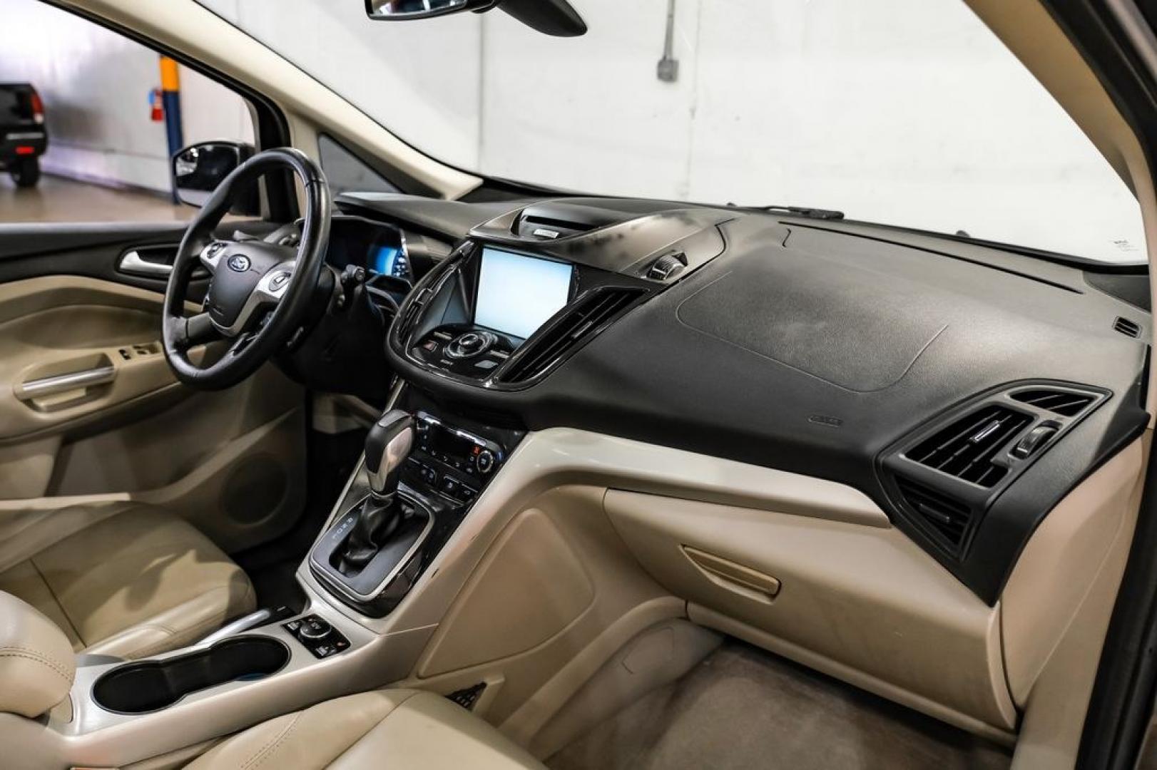 2015 Magnetic /Medium Light Stone Ford C-Max Energi SEL (1FADP5CUXFL) with an I4 Hybrid engine, CVT transmission, located at 15300 Midway Rd., Addison, TX, 75001, (972) 702-0011, 32.958321, -96.838074- Photo#12