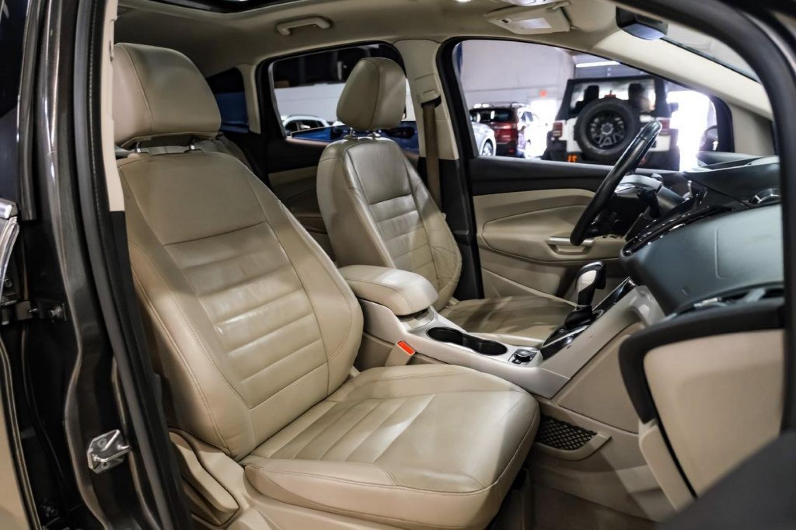2015 Magnetic /Medium Light Stone Ford C-Max Energi SEL (1FADP5CUXFL) with an I4 Hybrid engine, CVT transmission, located at 15300 Midway Rd., Addison, TX, 75001, (972) 702-0011, 32.958321, -96.838074- Photo#31