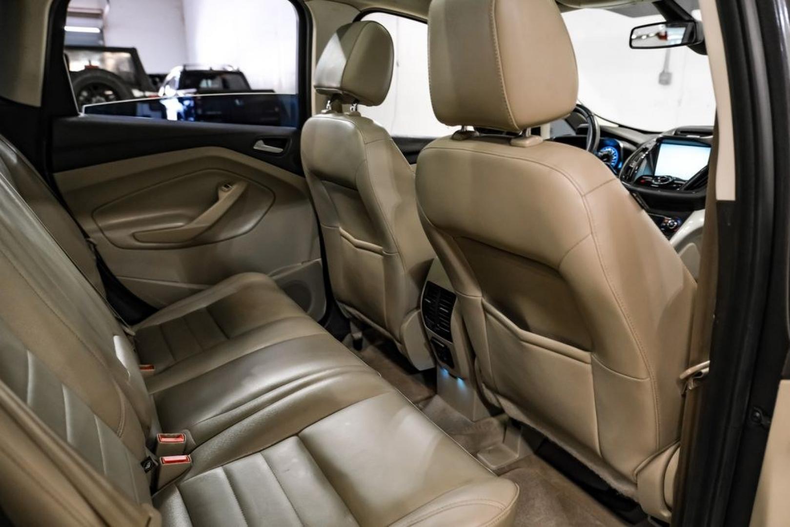 2015 Magnetic /Medium Light Stone Ford C-Max Energi SEL (1FADP5CUXFL) with an I4 Hybrid engine, CVT transmission, located at 15300 Midway Rd., Addison, TX, 75001, (972) 702-0011, 32.958321, -96.838074- Photo#33