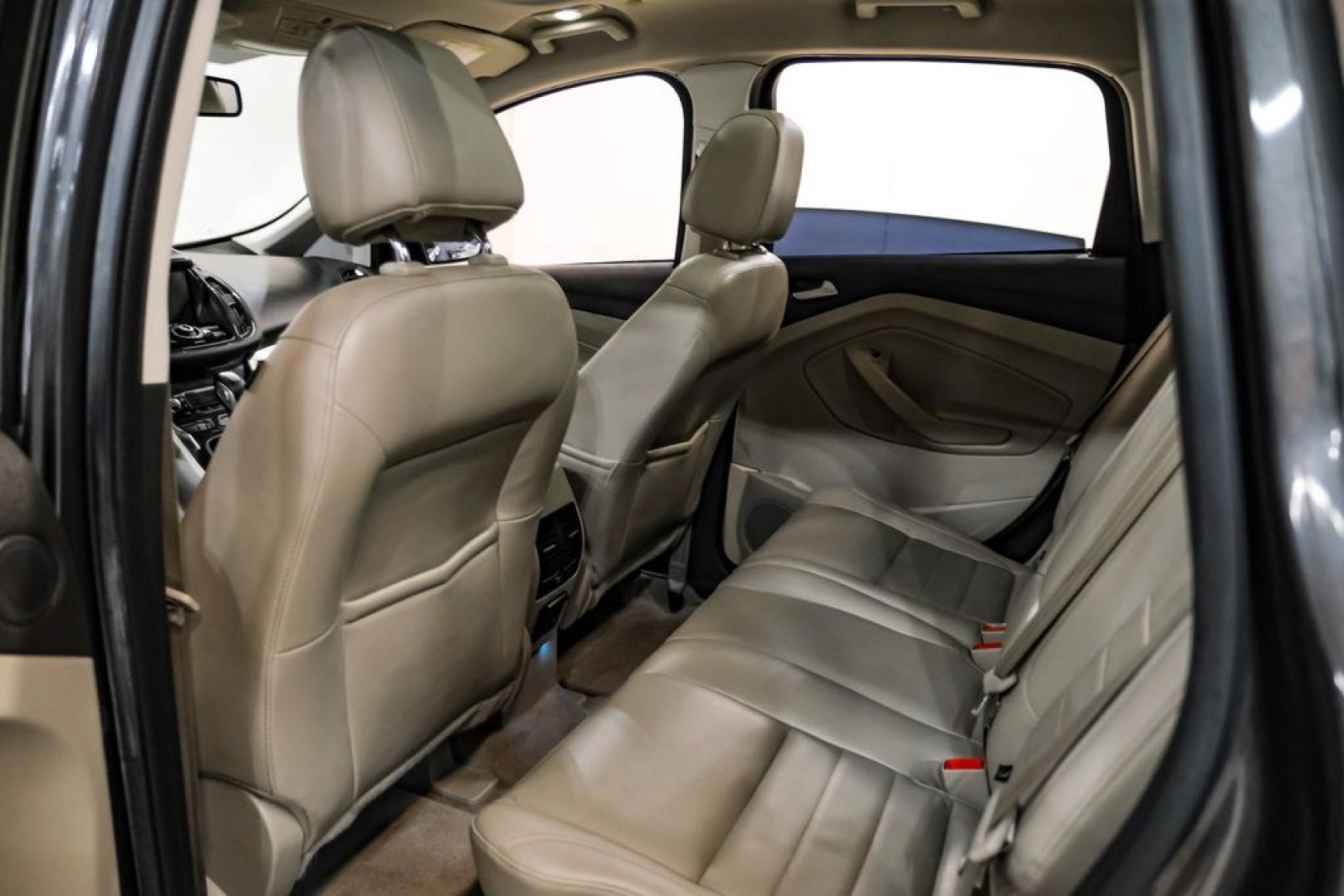 2015 Magnetic /Medium Light Stone Ford C-Max Energi SEL (1FADP5CUXFL) with an I4 Hybrid engine, CVT transmission, located at 15300 Midway Rd., Addison, TX, 75001, (972) 702-0011, 32.958321, -96.838074- Photo#34