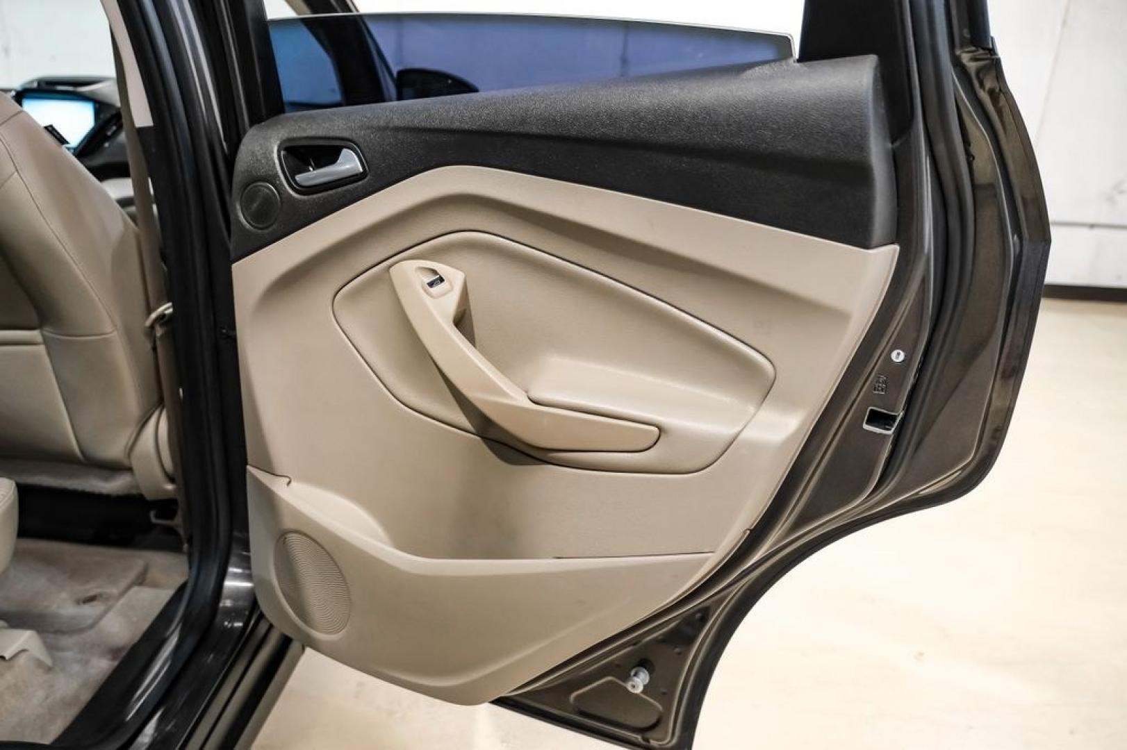 2015 Magnetic /Medium Light Stone Ford C-Max Energi SEL (1FADP5CUXFL) with an I4 Hybrid engine, CVT transmission, located at 15300 Midway Rd., Addison, TX, 75001, (972) 702-0011, 32.958321, -96.838074- Photo#42