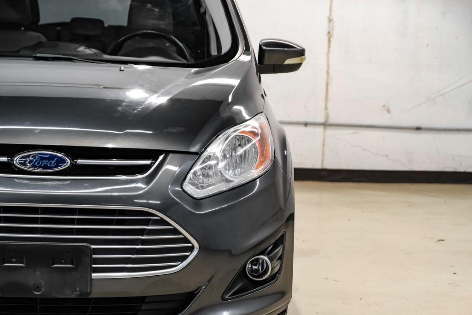 2015 Magnetic /Medium Light Stone Ford C-Max Energi SEL (1FADP5CUXFL) with an I4 Hybrid engine, CVT transmission, located at 15300 Midway Rd., Addison, TX, 75001, (972) 702-0011, 32.958321, -96.838074- Photo#43