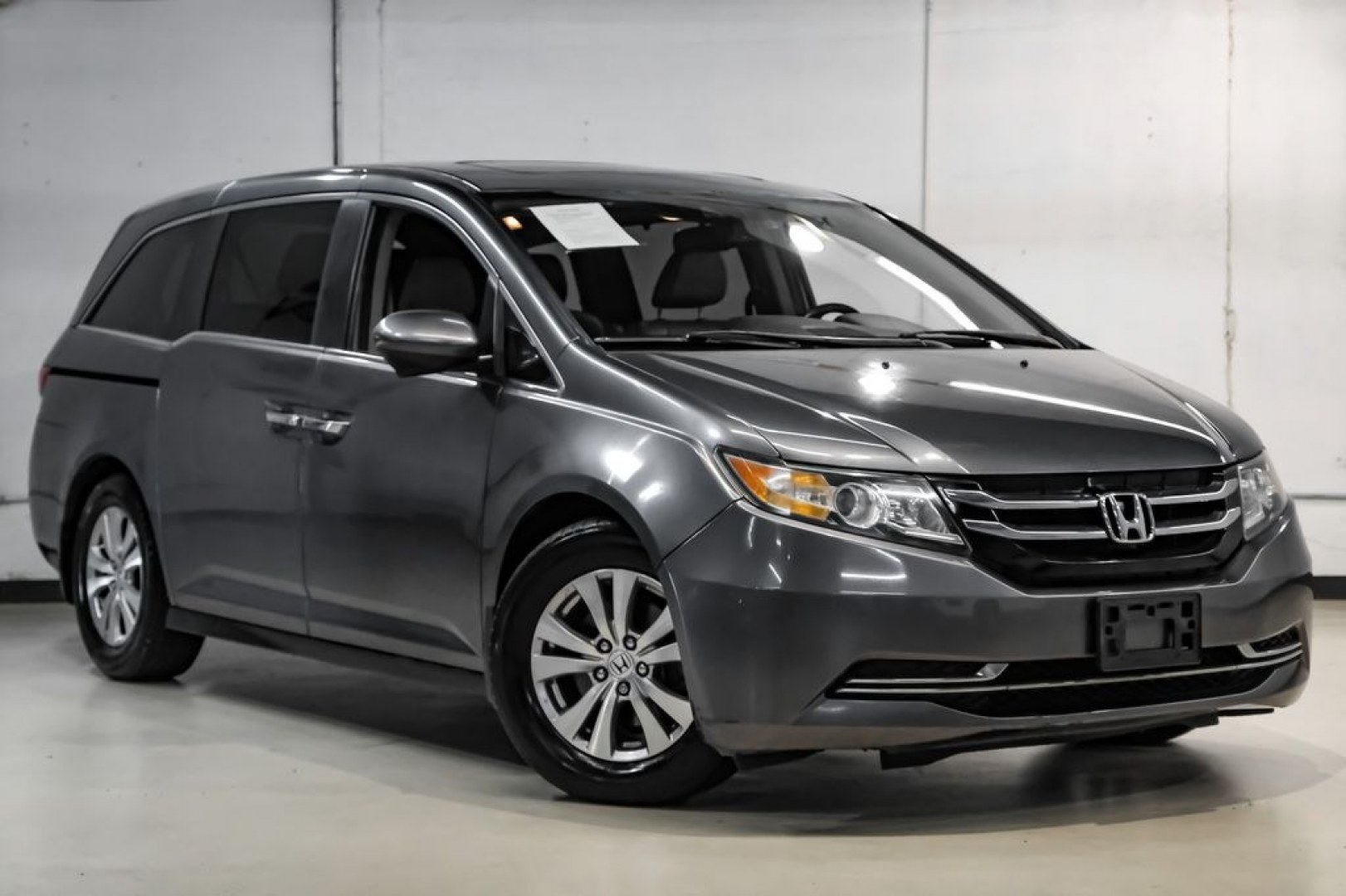 2014 Modern Steel Metallic /Beige Honda Odyssey EX-L (5FNRL5H69EB) with an 3.5L V6 SOHC i-VTEC 24V engine, Automatic transmission, located at 15300 Midway Rd., Addison, TX, 75001, (972) 702-0011, 32.958321, -96.838074- Photo#8