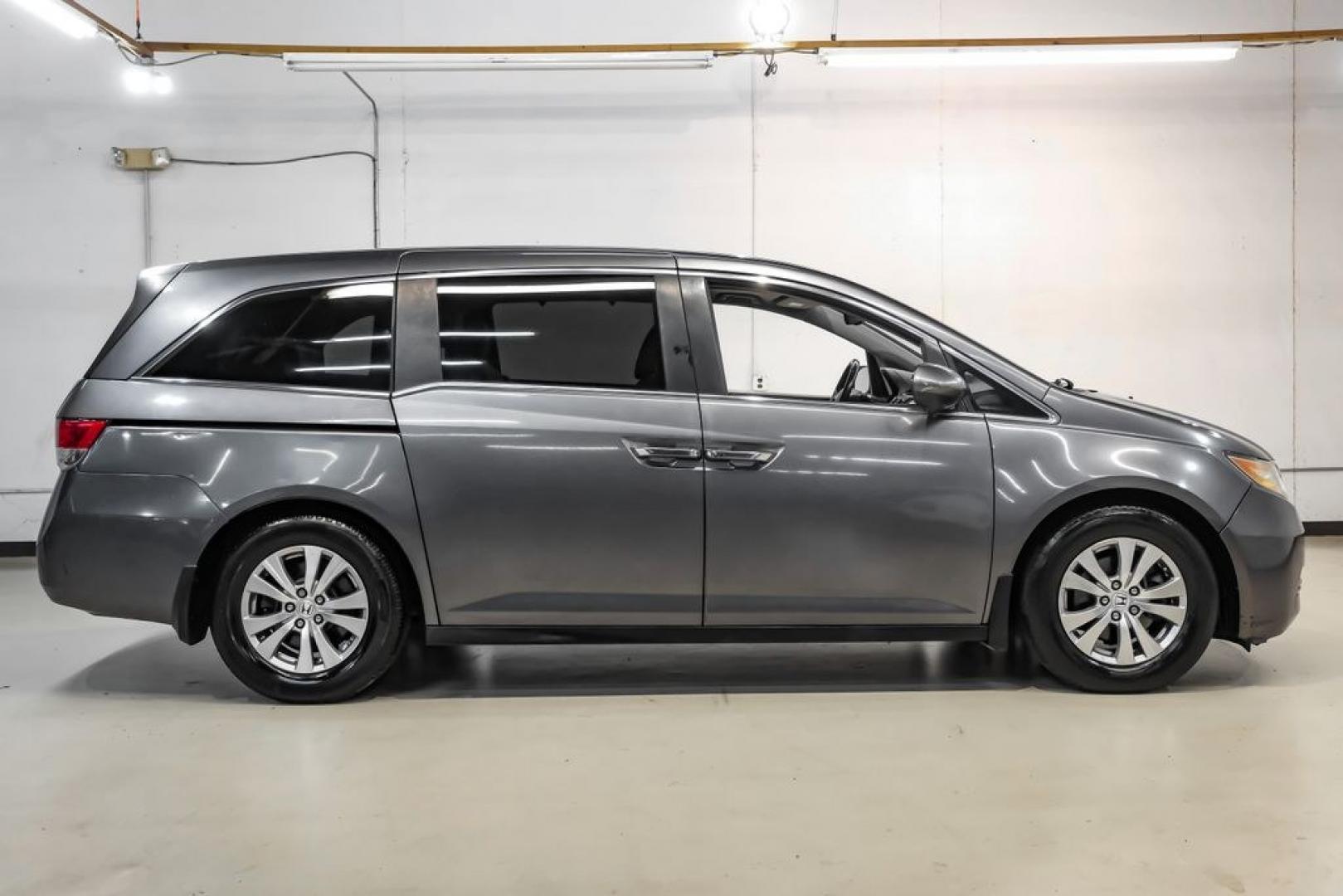 2014 Modern Steel Metallic /Beige Honda Odyssey EX-L (5FNRL5H69EB) with an 3.5L V6 SOHC i-VTEC 24V engine, Automatic transmission, located at 15300 Midway Rd., Addison, TX, 75001, (972) 702-0011, 32.958321, -96.838074- Photo#9