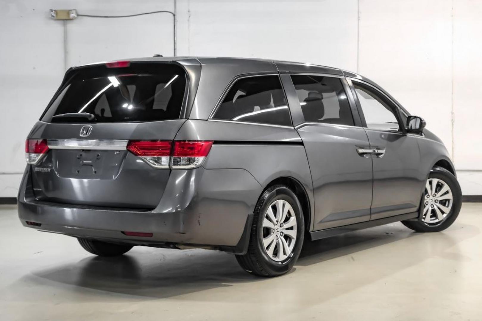 2014 Modern Steel Metallic /Beige Honda Odyssey EX-L (5FNRL5H69EB) with an 3.5L V6 SOHC i-VTEC 24V engine, Automatic transmission, located at 15300 Midway Rd., Addison, TX, 75001, (972) 702-0011, 32.958321, -96.838074- Photo#10