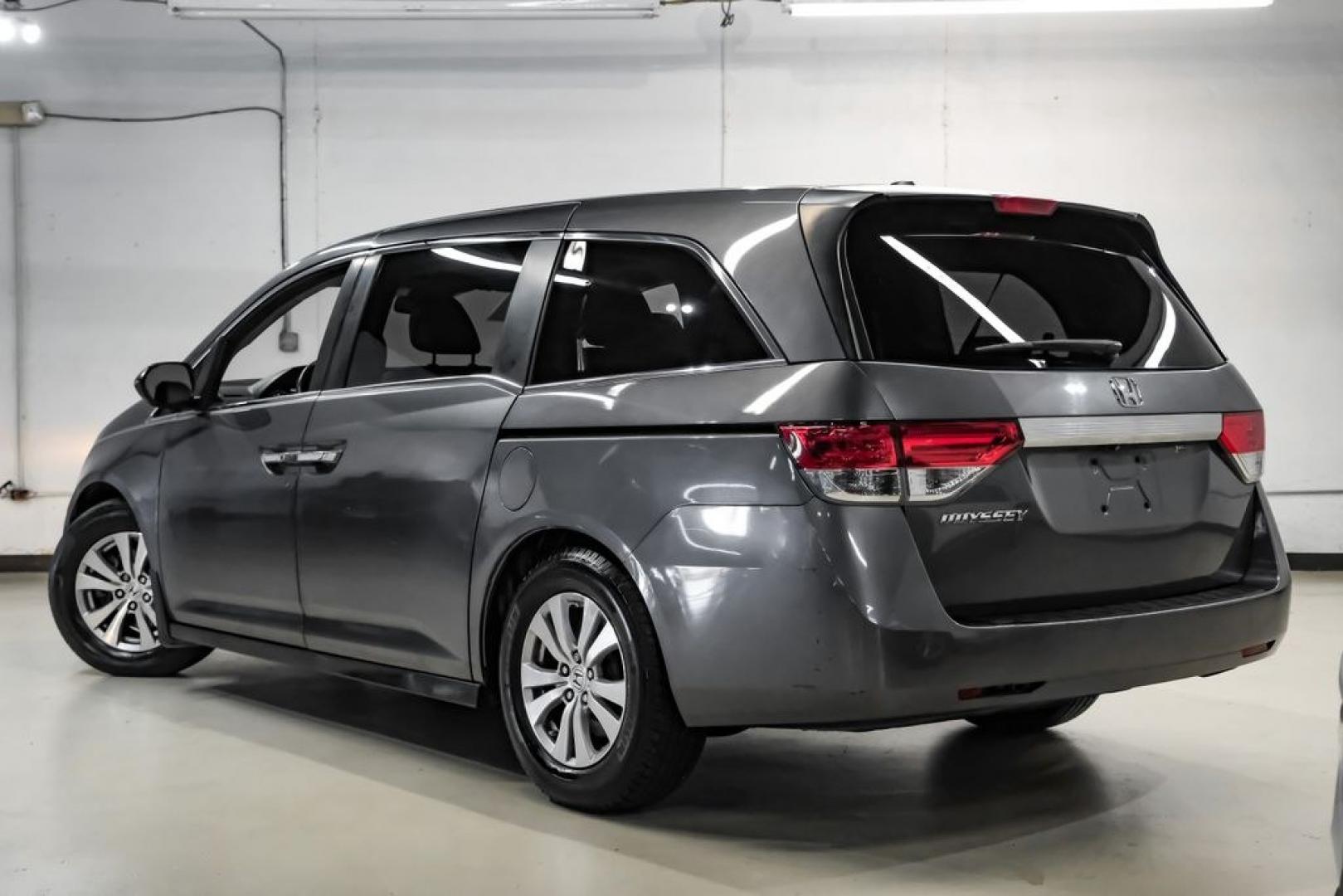 2014 Modern Steel Metallic /Beige Honda Odyssey EX-L (5FNRL5H69EB) with an 3.5L V6 SOHC i-VTEC 24V engine, Automatic transmission, located at 15300 Midway Rd., Addison, TX, 75001, (972) 702-0011, 32.958321, -96.838074- Photo#12