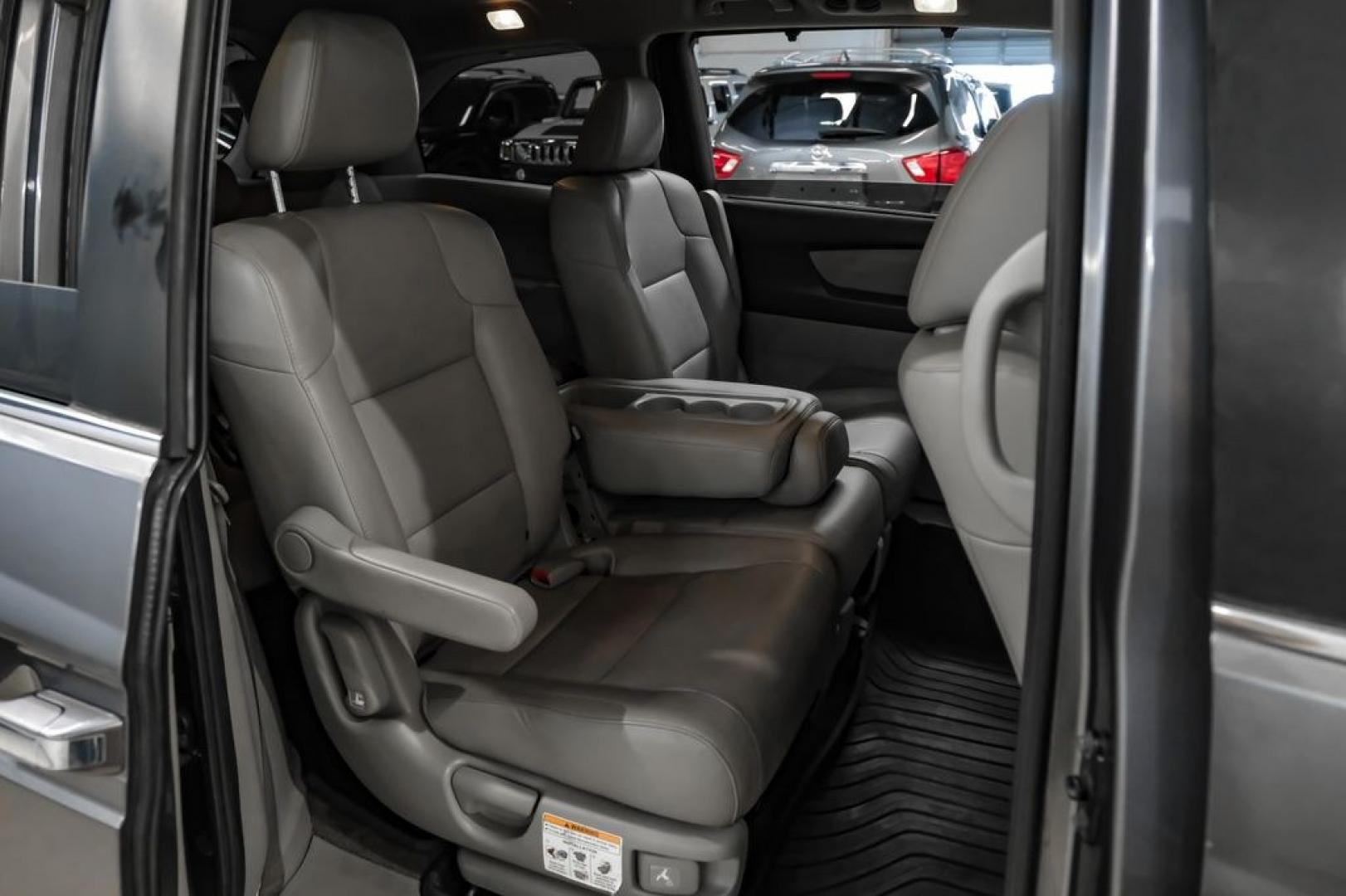 2014 Modern Steel Metallic /Beige Honda Odyssey EX-L (5FNRL5H69EB) with an 3.5L V6 SOHC i-VTEC 24V engine, Automatic transmission, located at 15300 Midway Rd., Addison, TX, 75001, (972) 702-0011, 32.958321, -96.838074- Photo#35