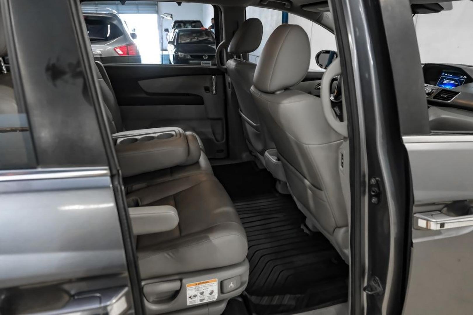2014 Modern Steel Metallic /Beige Honda Odyssey EX-L (5FNRL5H69EB) with an 3.5L V6 SOHC i-VTEC 24V engine, Automatic transmission, located at 15300 Midway Rd., Addison, TX, 75001, (972) 702-0011, 32.958321, -96.838074- Photo#36
