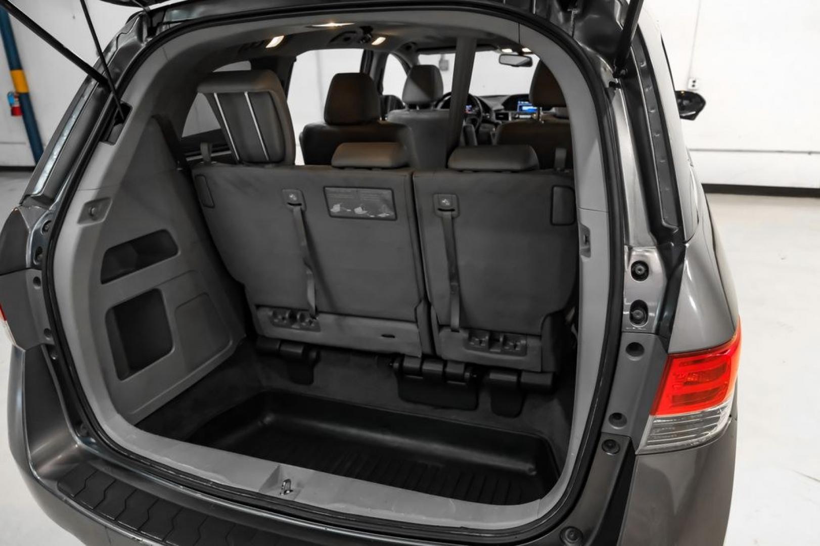 2014 Modern Steel Metallic /Beige Honda Odyssey EX-L (5FNRL5H69EB) with an 3.5L V6 SOHC i-VTEC 24V engine, Automatic transmission, located at 15300 Midway Rd., Addison, TX, 75001, (972) 702-0011, 32.958321, -96.838074- Photo#51