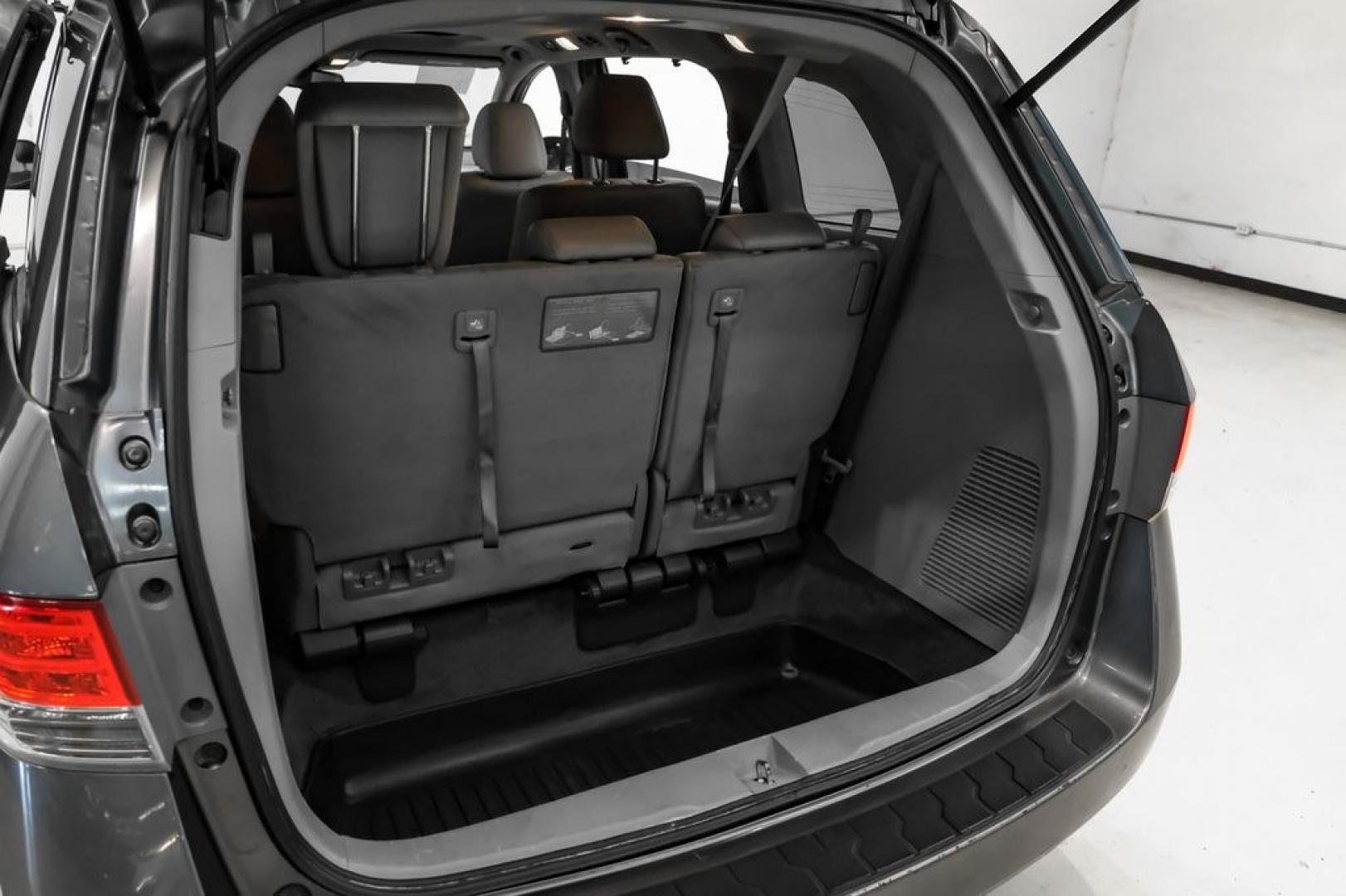 2014 Modern Steel Metallic /Beige Honda Odyssey EX-L (5FNRL5H69EB) with an 3.5L V6 SOHC i-VTEC 24V engine, Automatic transmission, located at 15300 Midway Rd., Addison, TX, 75001, (972) 702-0011, 32.958321, -96.838074- Photo#52