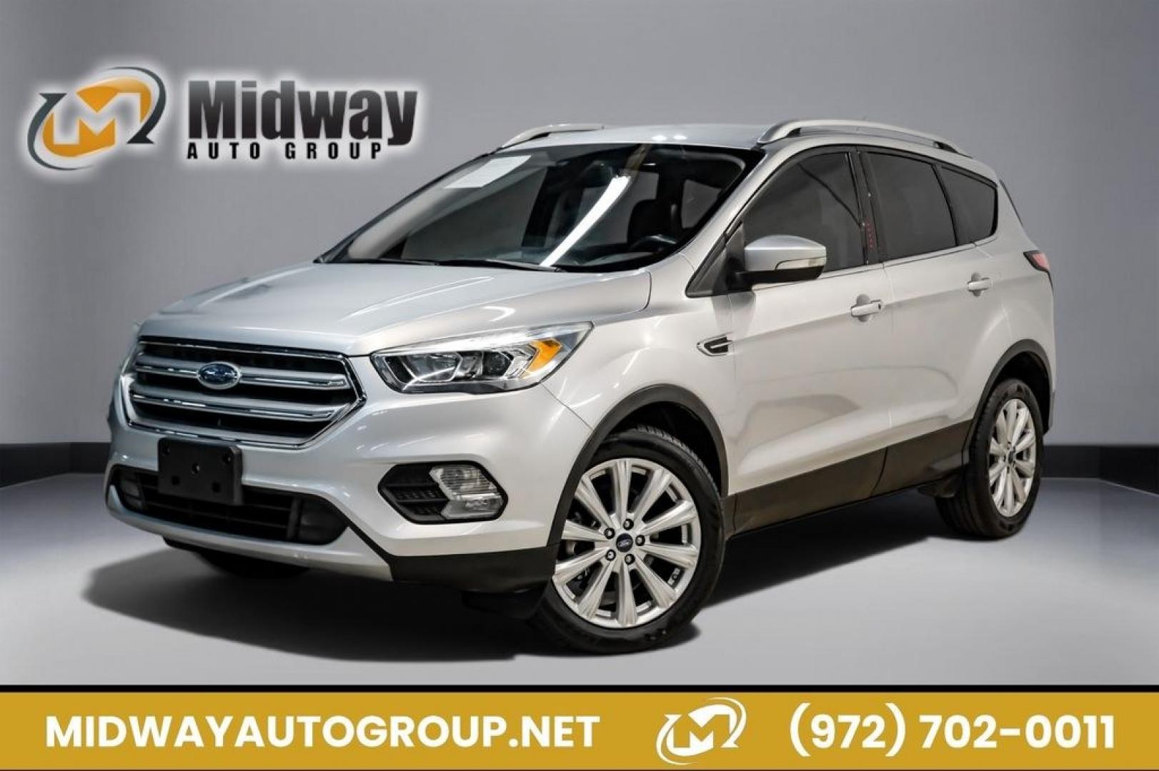 2017 Ingot Silver /Black Ford Escape Titanium (1FMCU0JD8HU) with an 1.5L EcoBoost engine, Automatic transmission, located at 15300 Midway Rd., Addison, TX, 75001, (972) 702-0011, 32.958321, -96.838074- Photo#0