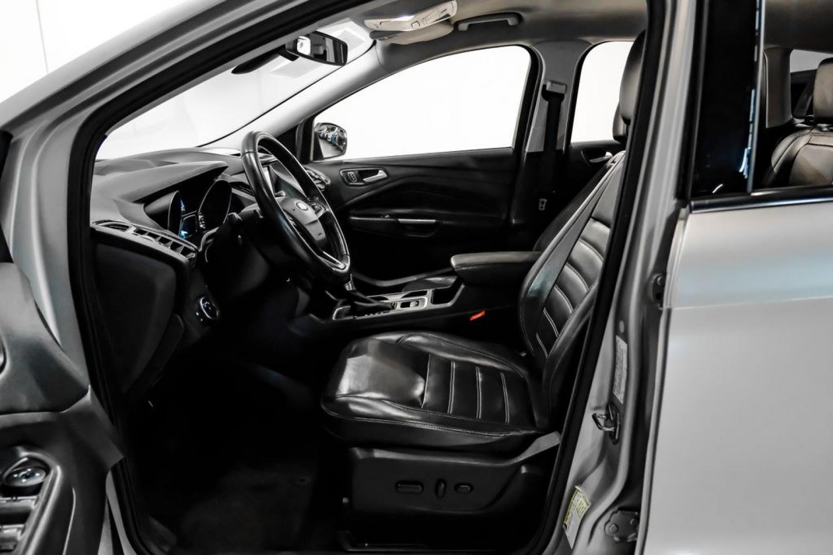 2017 Ingot Silver /Black Ford Escape Titanium (1FMCU0JD8HU) with an 1.5L EcoBoost engine, Automatic transmission, located at 15300 Midway Rd., Addison, TX, 75001, (972) 702-0011, 32.958321, -96.838074- Photo#3