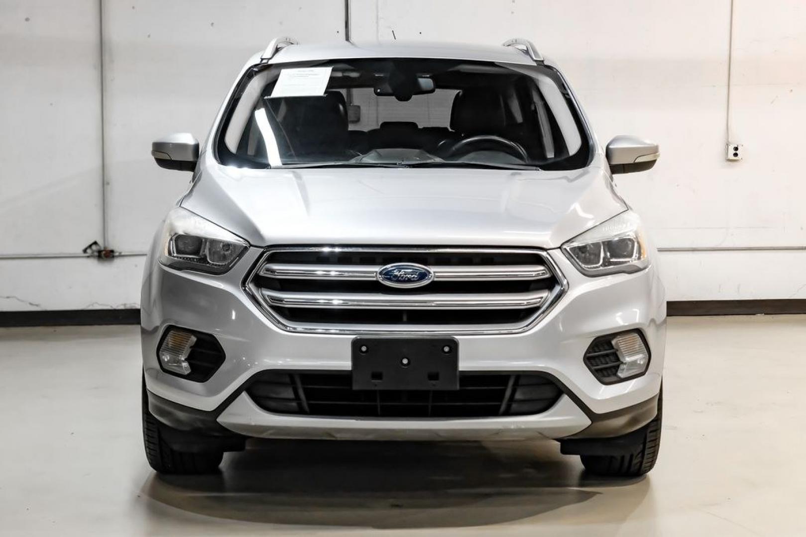 2017 Ingot Silver /Black Ford Escape Titanium (1FMCU0JD8HU) with an 1.5L EcoBoost engine, Automatic transmission, located at 15300 Midway Rd., Addison, TX, 75001, (972) 702-0011, 32.958321, -96.838074- Photo#4