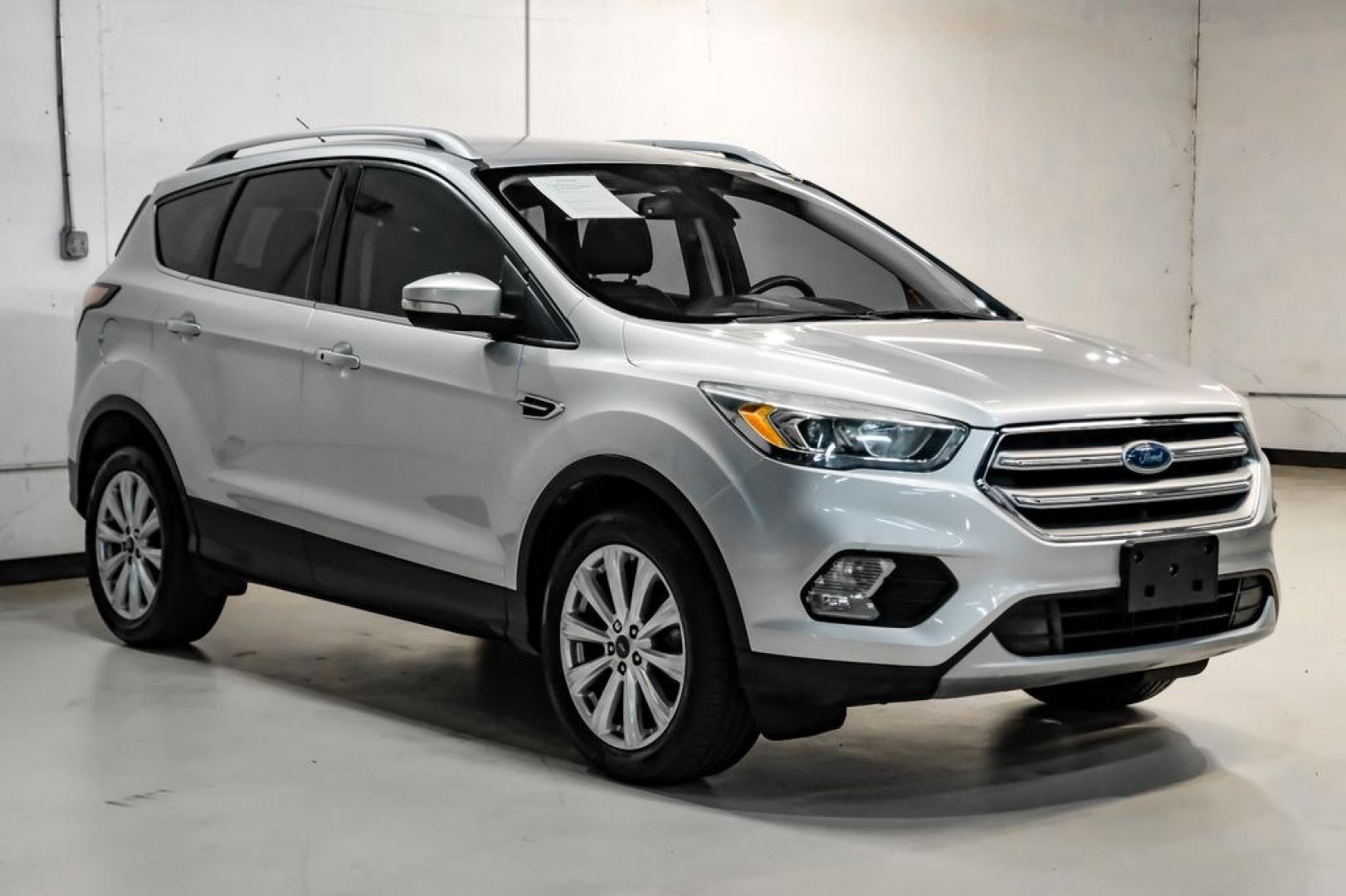 2017 Ingot Silver /Black Ford Escape Titanium (1FMCU0JD8HU) with an 1.5L EcoBoost engine, Automatic transmission, located at 15300 Midway Rd., Addison, TX, 75001, (972) 702-0011, 32.958321, -96.838074- Photo#5