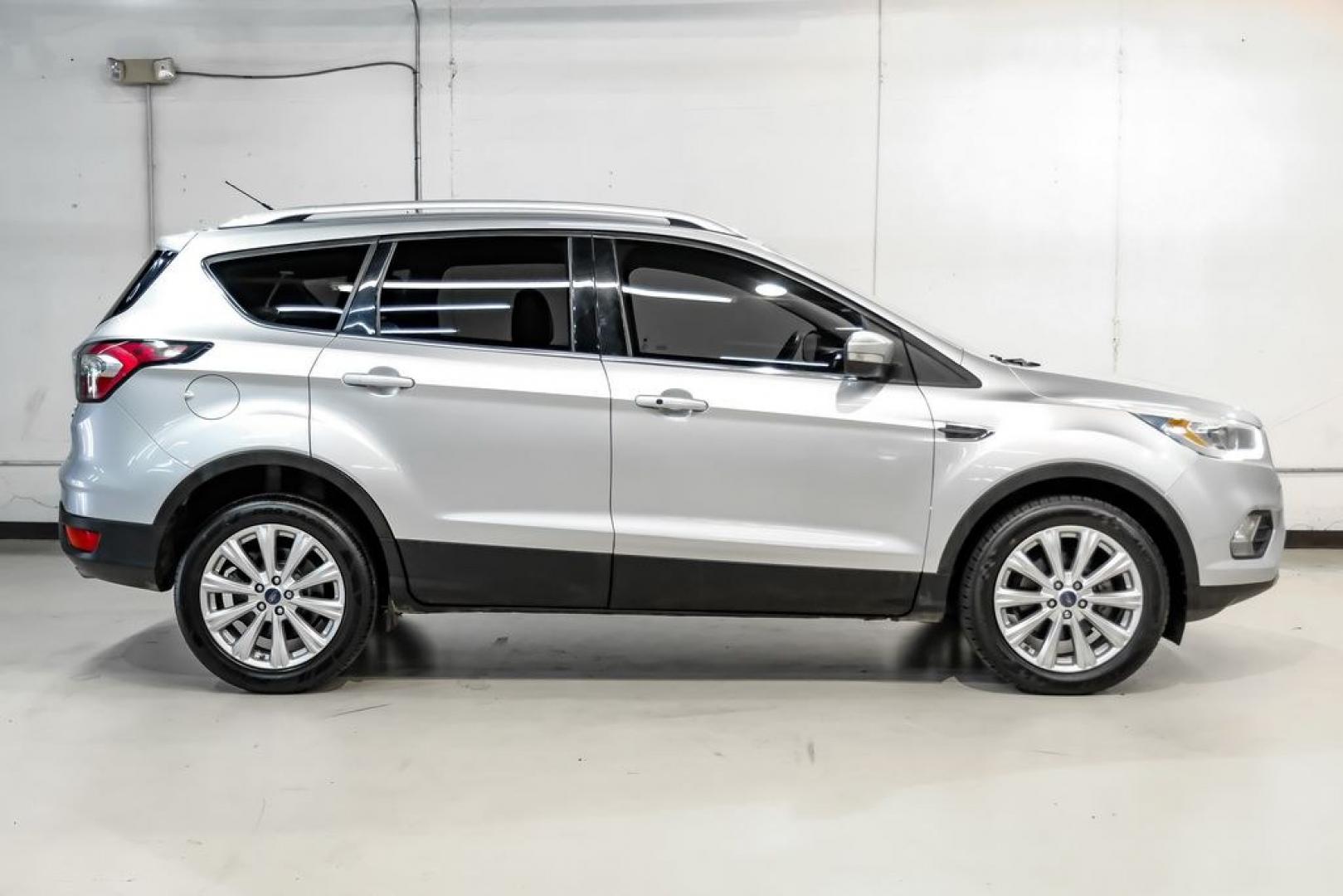 2017 Ingot Silver /Black Ford Escape Titanium (1FMCU0JD8HU) with an 1.5L EcoBoost engine, Automatic transmission, located at 15300 Midway Rd., Addison, TX, 75001, (972) 702-0011, 32.958321, -96.838074- Photo#6