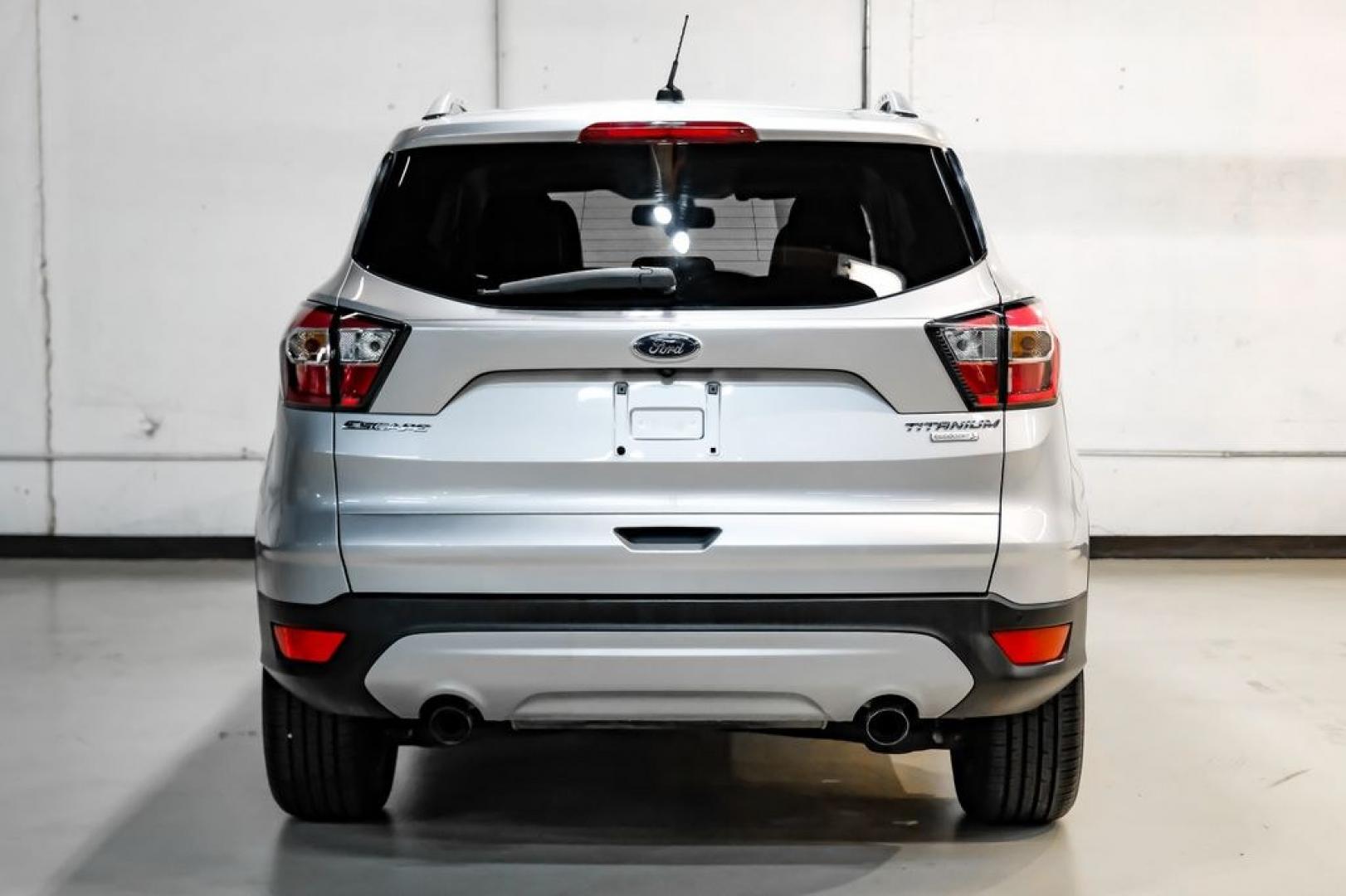 2017 Ingot Silver /Black Ford Escape Titanium (1FMCU0JD8HU) with an 1.5L EcoBoost engine, Automatic transmission, located at 15300 Midway Rd., Addison, TX, 75001, (972) 702-0011, 32.958321, -96.838074- Photo#8