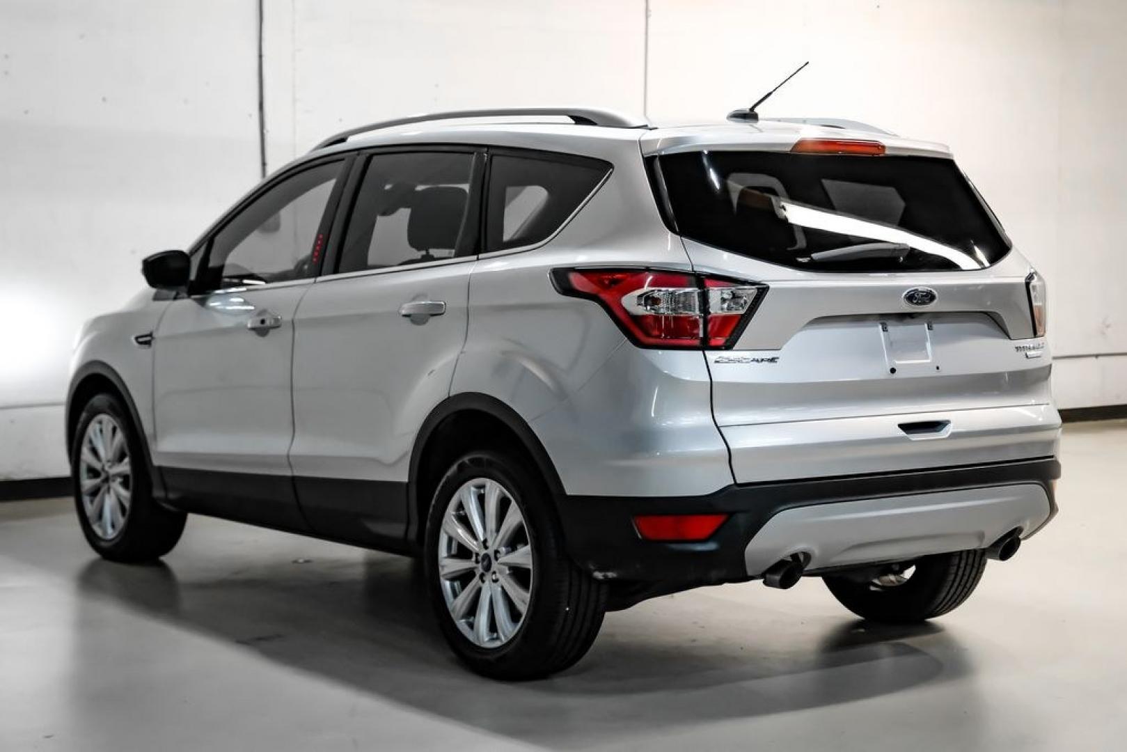 2017 Ingot Silver /Black Ford Escape Titanium (1FMCU0JD8HU) with an 1.5L EcoBoost engine, Automatic transmission, located at 15300 Midway Rd., Addison, TX, 75001, (972) 702-0011, 32.958321, -96.838074- Photo#9
