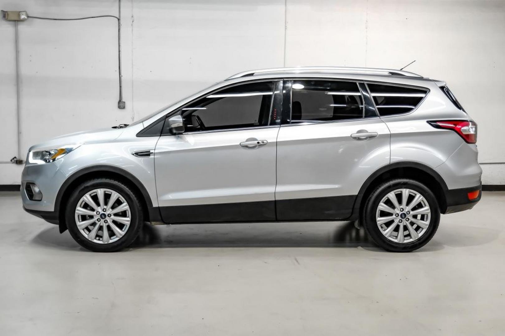 2017 Ingot Silver /Black Ford Escape Titanium (1FMCU0JD8HU) with an 1.5L EcoBoost engine, Automatic transmission, located at 15300 Midway Rd., Addison, TX, 75001, (972) 702-0011, 32.958321, -96.838074- Photo#10