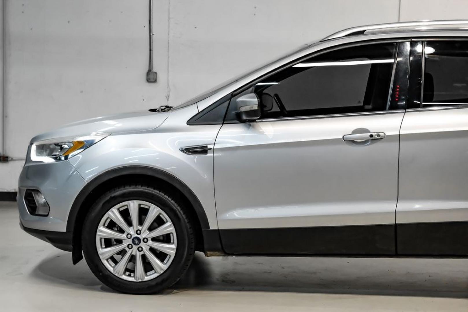 2017 Ingot Silver /Black Ford Escape Titanium (1FMCU0JD8HU) with an 1.5L EcoBoost engine, Automatic transmission, located at 15300 Midway Rd., Addison, TX, 75001, (972) 702-0011, 32.958321, -96.838074- Photo#11