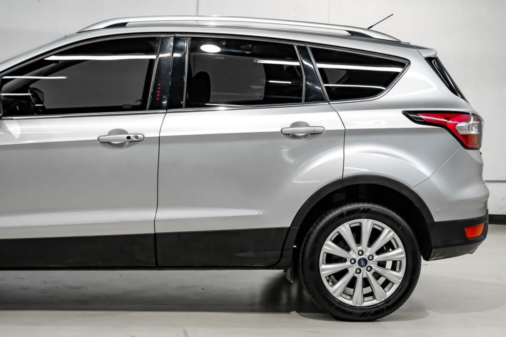 2017 Ingot Silver /Black Ford Escape Titanium (1FMCU0JD8HU) with an 1.5L EcoBoost engine, Automatic transmission, located at 15300 Midway Rd., Addison, TX, 75001, (972) 702-0011, 32.958321, -96.838074- Photo#12