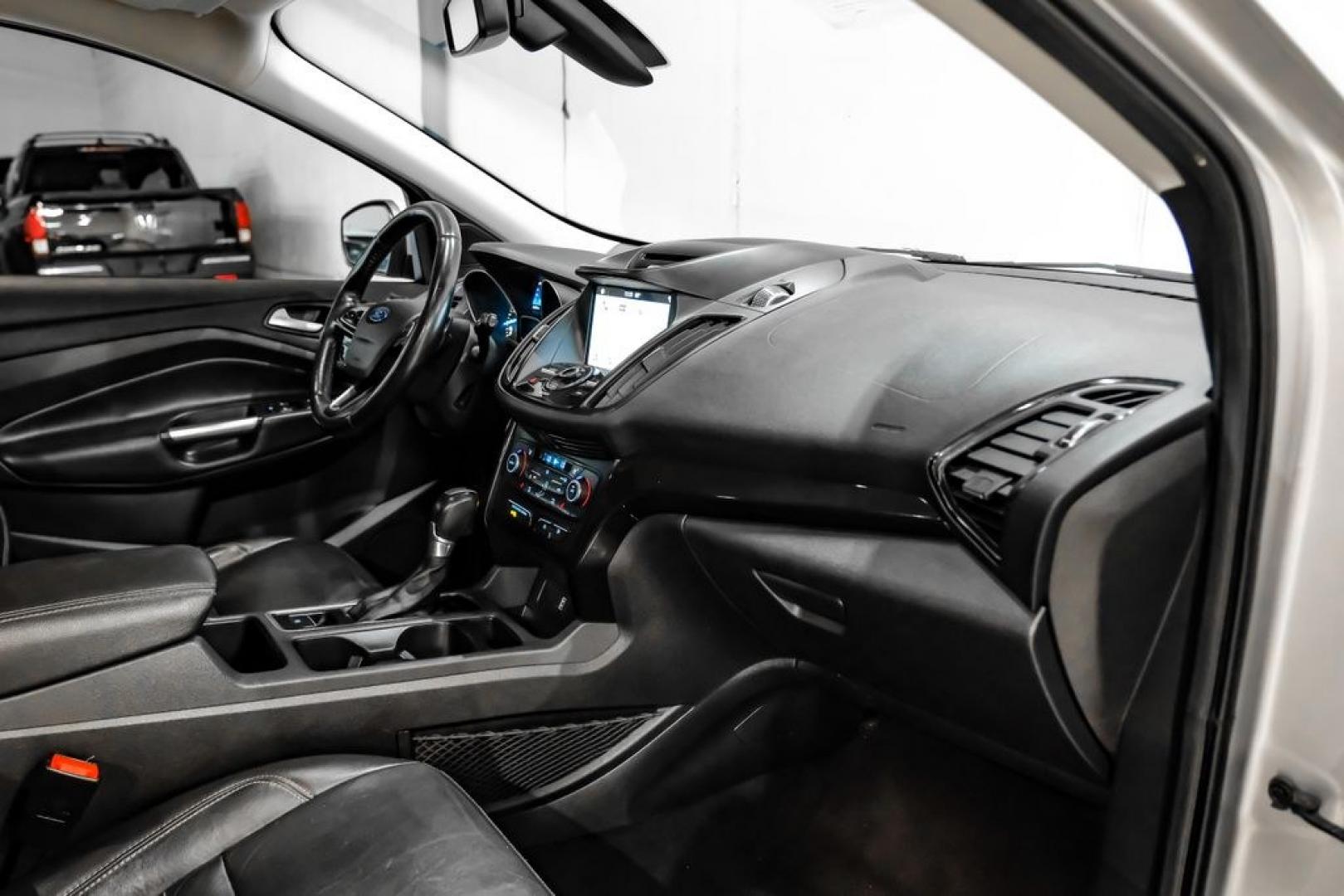 2017 Ingot Silver /Black Ford Escape Titanium (1FMCU0JD8HU) with an 1.5L EcoBoost engine, Automatic transmission, located at 15300 Midway Rd., Addison, TX, 75001, (972) 702-0011, 32.958321, -96.838074- Photo#13