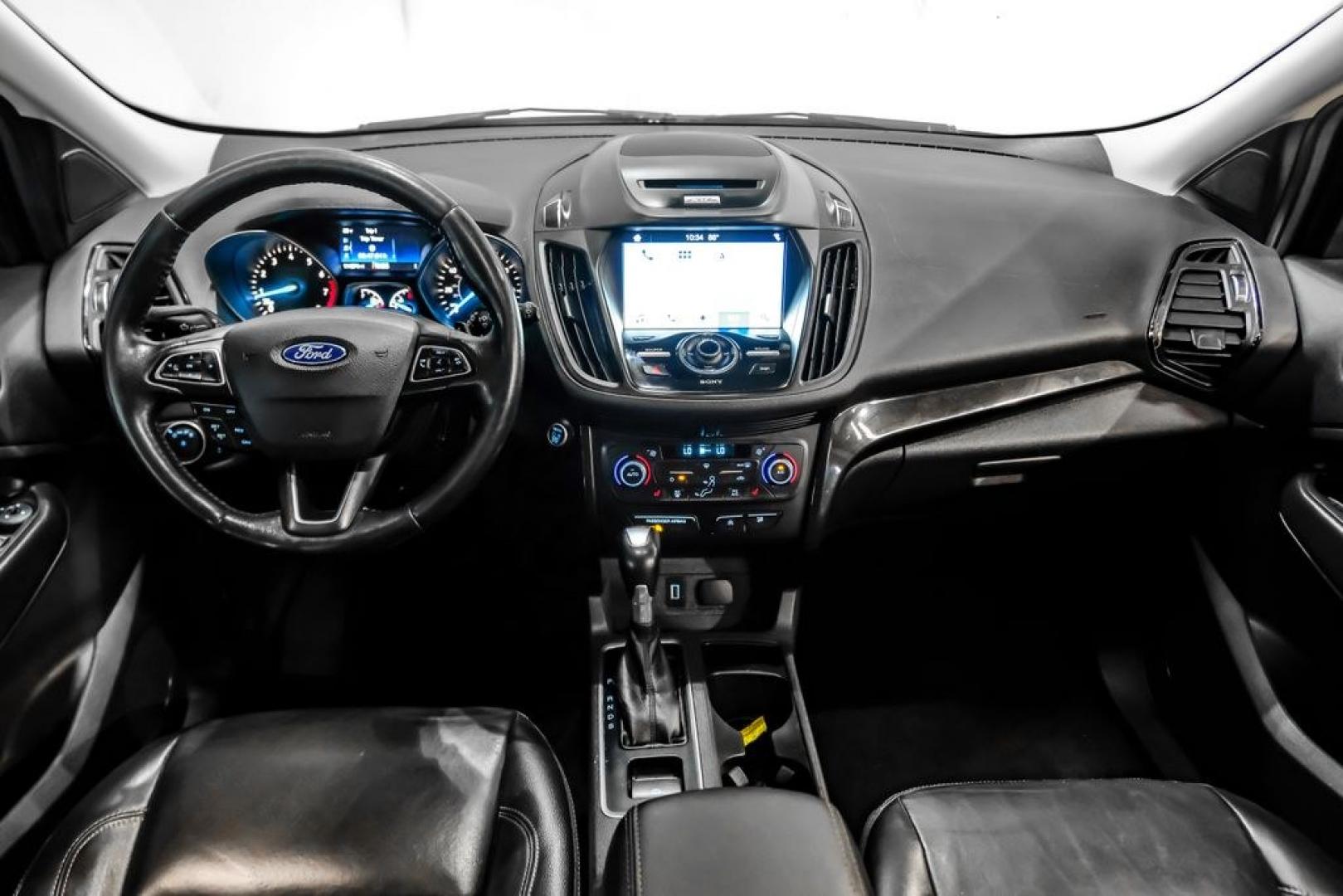 2017 Ingot Silver /Black Ford Escape Titanium (1FMCU0JD8HU) with an 1.5L EcoBoost engine, Automatic transmission, located at 15300 Midway Rd., Addison, TX, 75001, (972) 702-0011, 32.958321, -96.838074- Photo#14