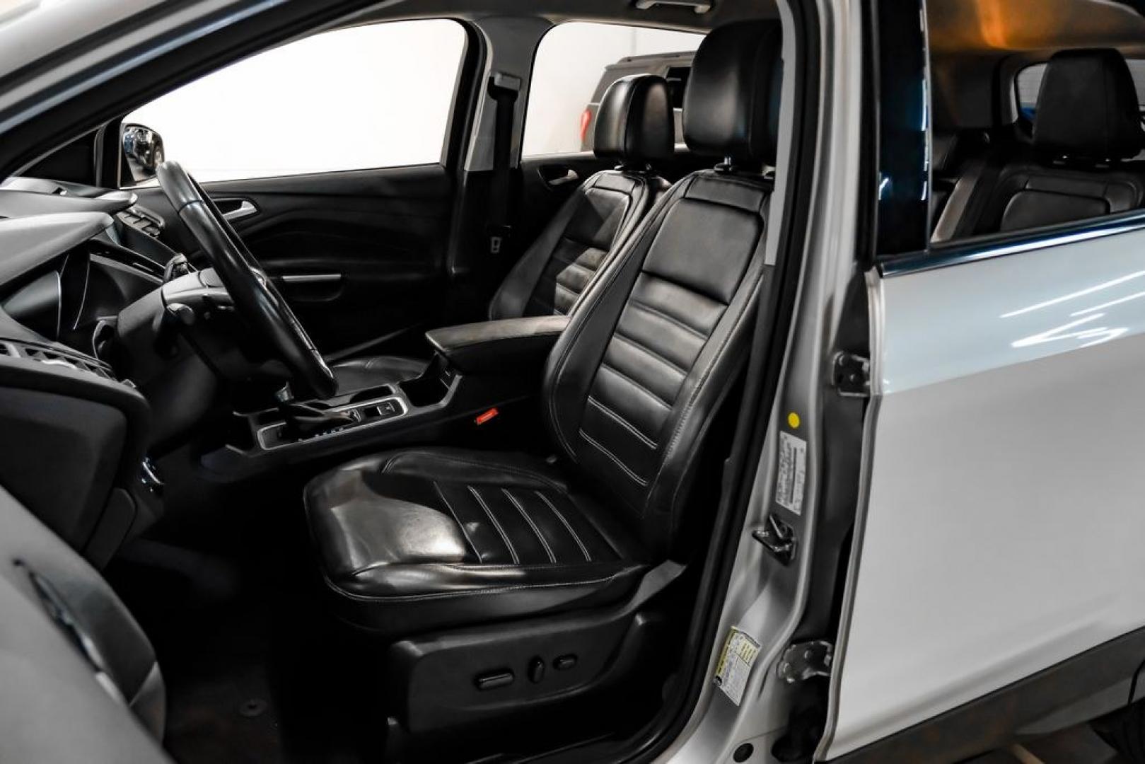 2017 Ingot Silver /Black Ford Escape Titanium (1FMCU0JD8HU) with an 1.5L EcoBoost engine, Automatic transmission, located at 15300 Midway Rd., Addison, TX, 75001, (972) 702-0011, 32.958321, -96.838074- Photo#29