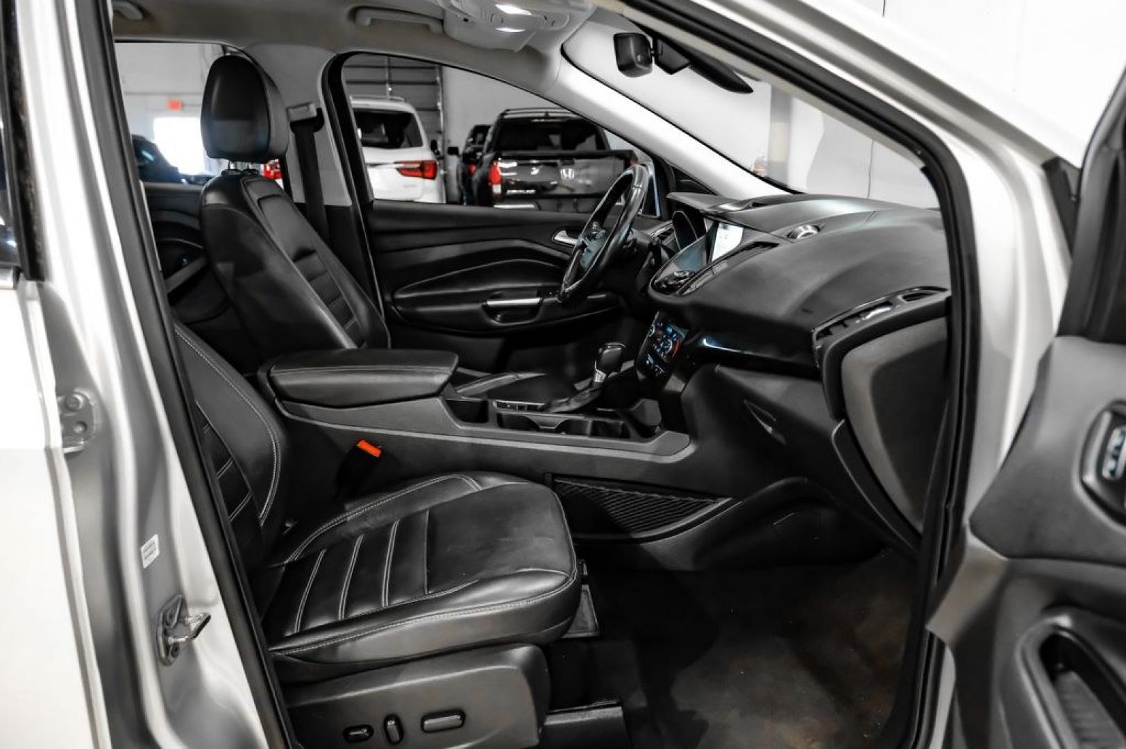 2017 Ingot Silver /Black Ford Escape Titanium (1FMCU0JD8HU) with an 1.5L EcoBoost engine, Automatic transmission, located at 15300 Midway Rd., Addison, TX, 75001, (972) 702-0011, 32.958321, -96.838074- Photo#30