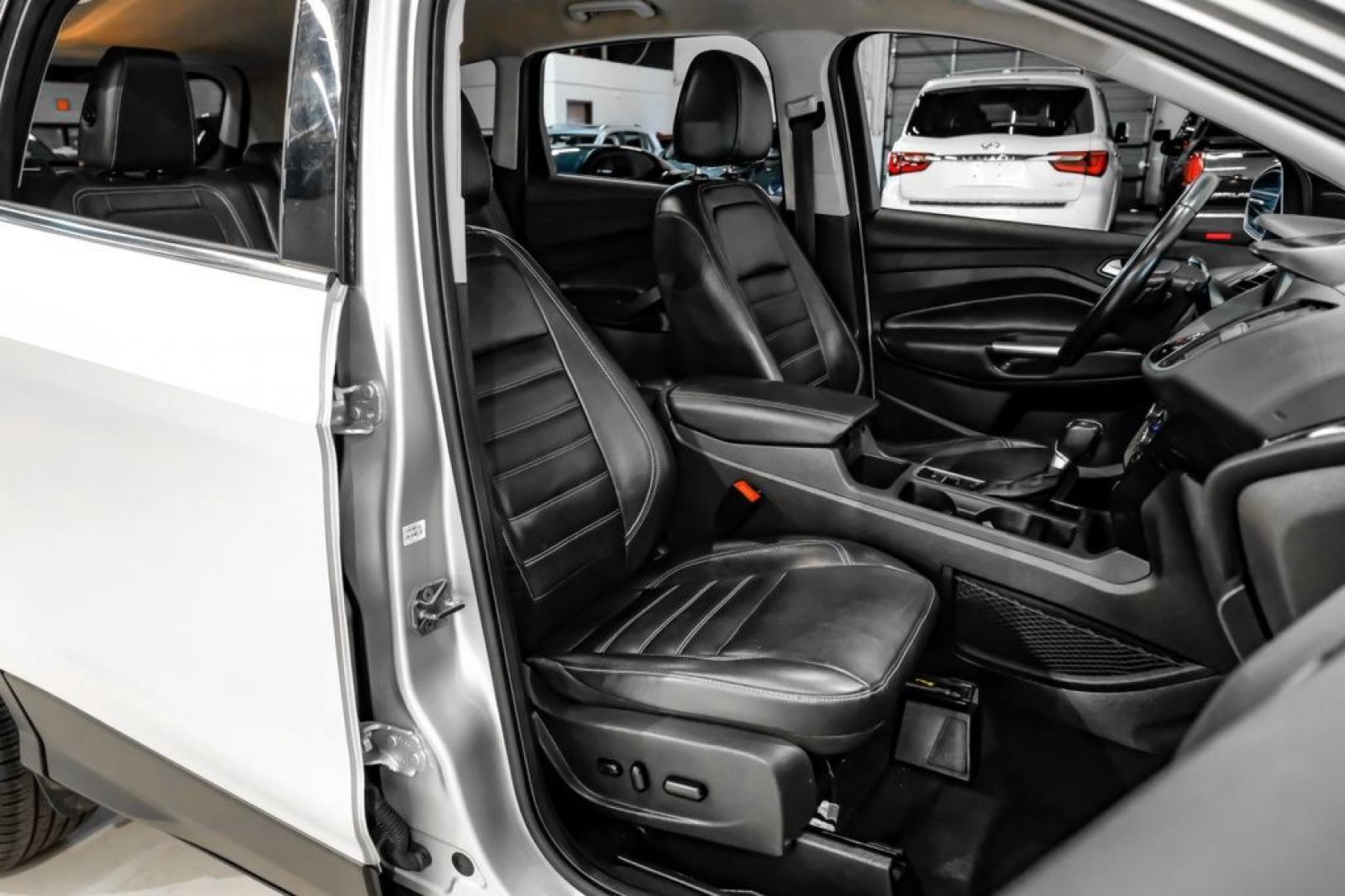 2017 Ingot Silver /Black Ford Escape Titanium (1FMCU0JD8HU) with an 1.5L EcoBoost engine, Automatic transmission, located at 15300 Midway Rd., Addison, TX, 75001, (972) 702-0011, 32.958321, -96.838074- Photo#31