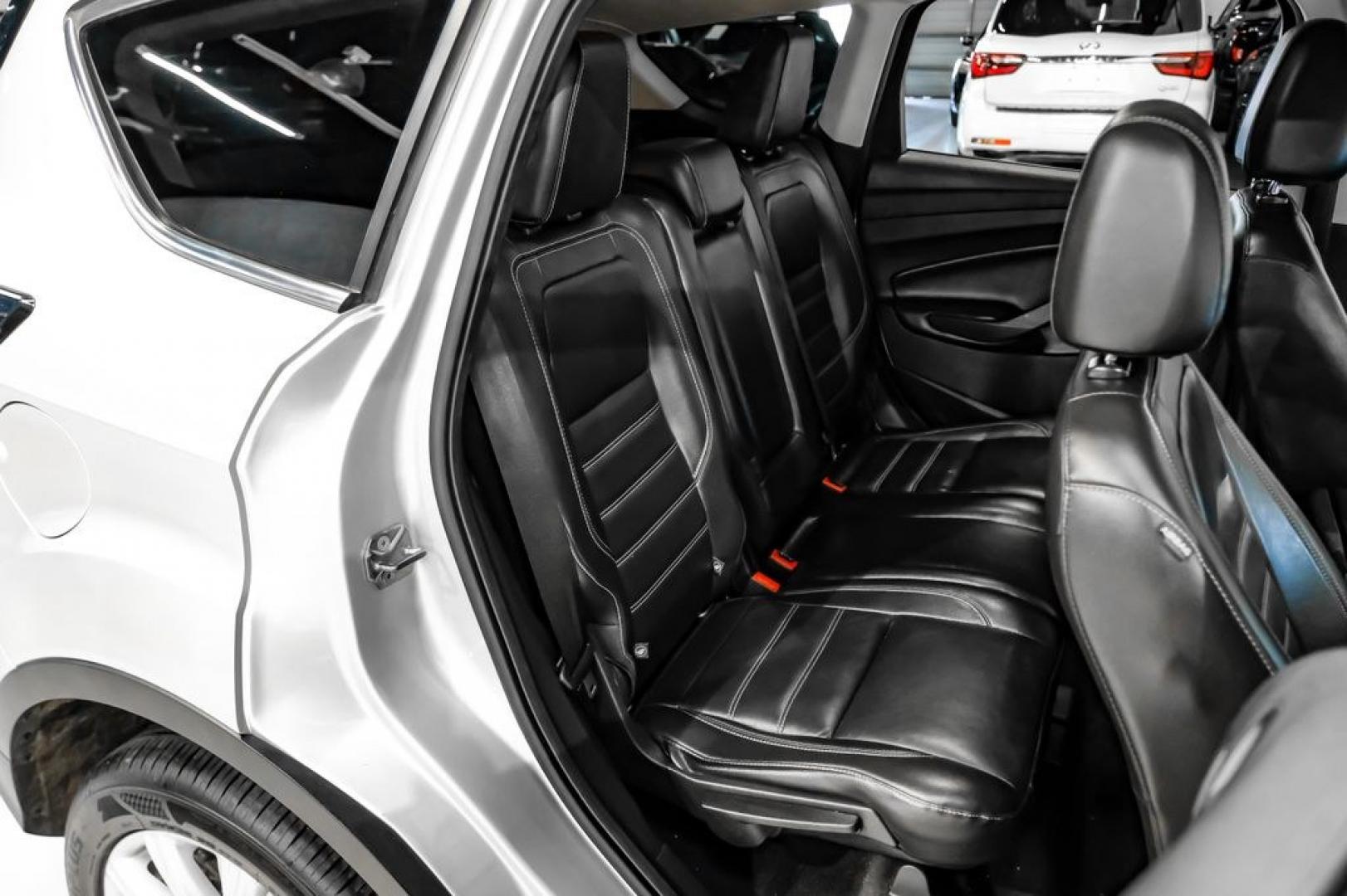 2017 Ingot Silver /Black Ford Escape Titanium (1FMCU0JD8HU) with an 1.5L EcoBoost engine, Automatic transmission, located at 15300 Midway Rd., Addison, TX, 75001, (972) 702-0011, 32.958321, -96.838074- Photo#32