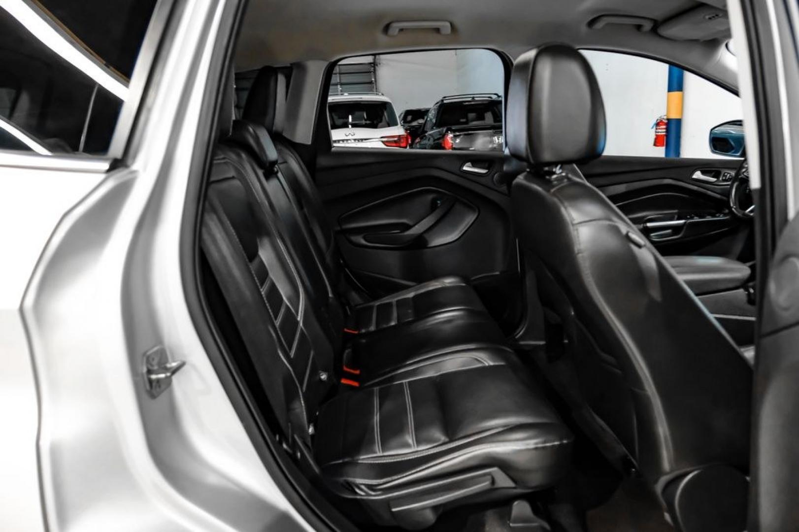 2017 Ingot Silver /Black Ford Escape Titanium (1FMCU0JD8HU) with an 1.5L EcoBoost engine, Automatic transmission, located at 15300 Midway Rd., Addison, TX, 75001, (972) 702-0011, 32.958321, -96.838074- Photo#33
