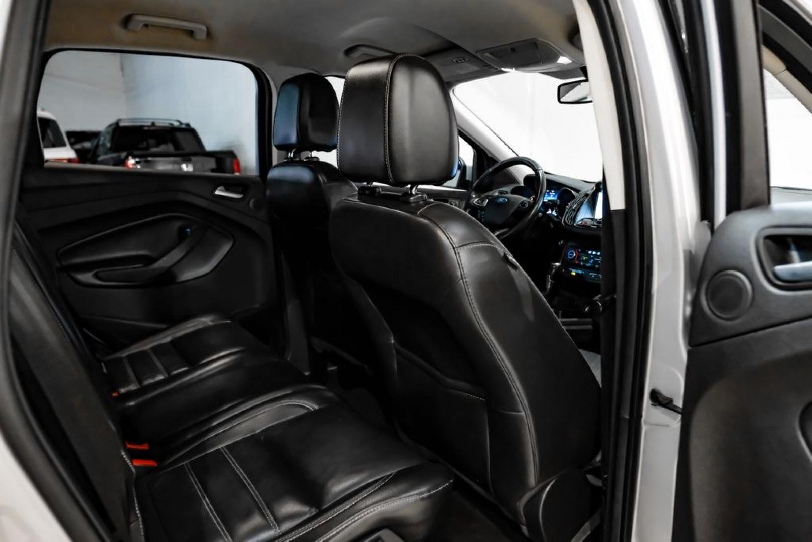 2017 Ingot Silver /Black Ford Escape Titanium (1FMCU0JD8HU) with an 1.5L EcoBoost engine, Automatic transmission, located at 15300 Midway Rd., Addison, TX, 75001, (972) 702-0011, 32.958321, -96.838074- Photo#34