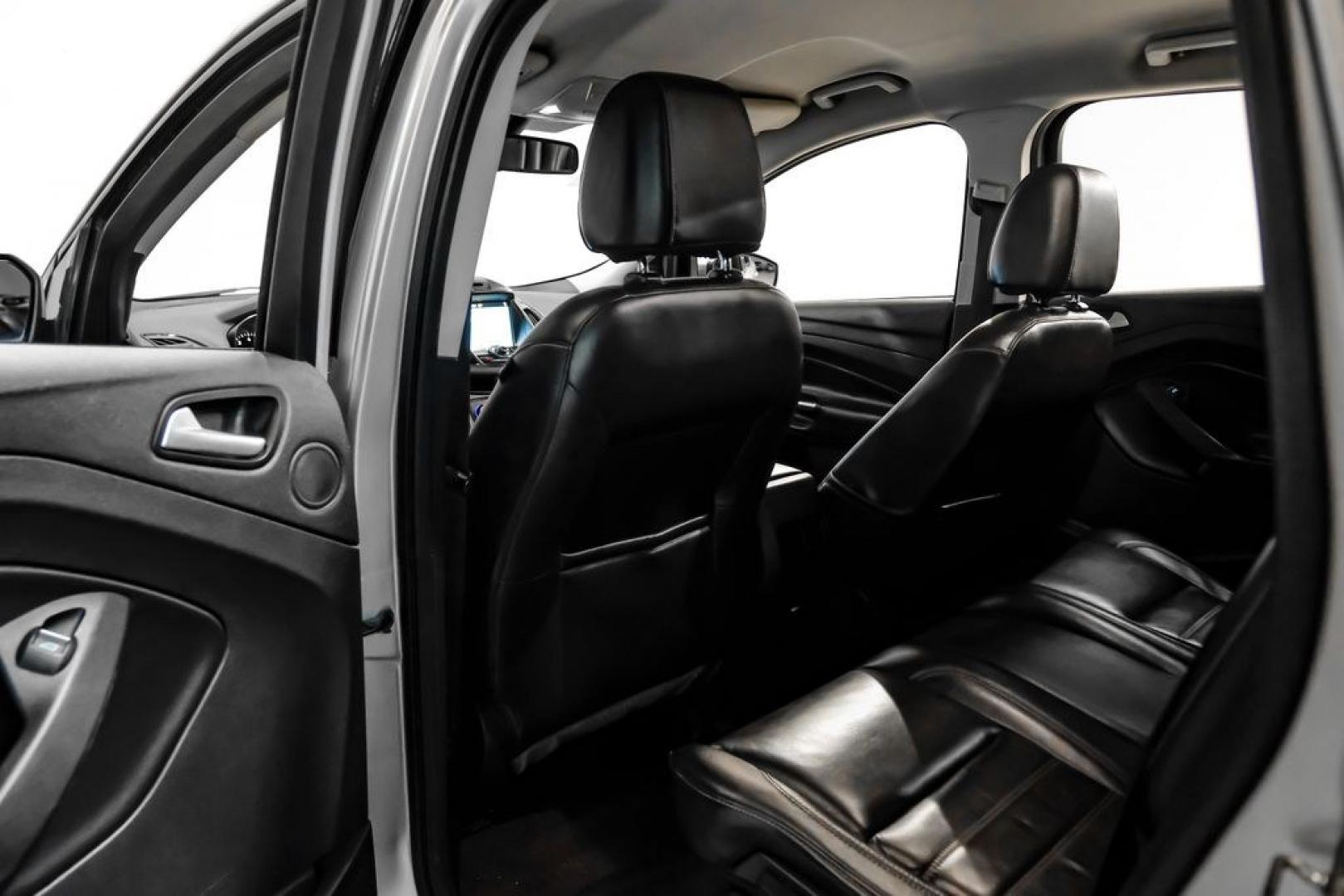 2017 Ingot Silver /Black Ford Escape Titanium (1FMCU0JD8HU) with an 1.5L EcoBoost engine, Automatic transmission, located at 15300 Midway Rd., Addison, TX, 75001, (972) 702-0011, 32.958321, -96.838074- Photo#35