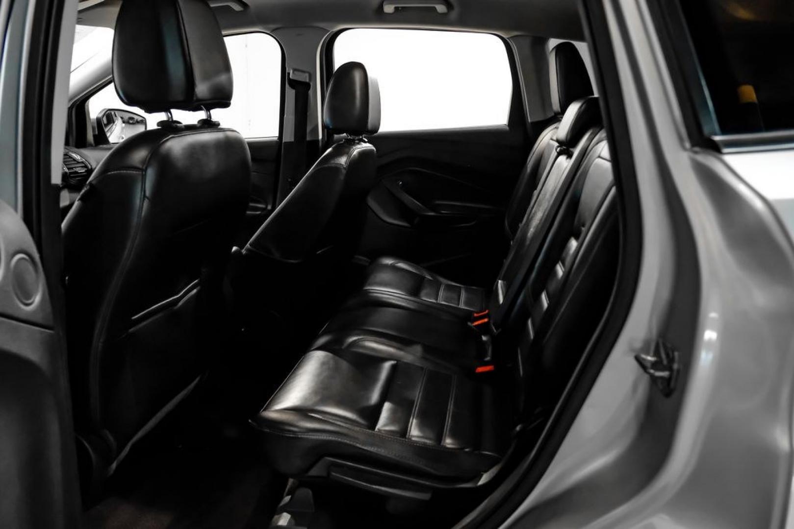 2017 Ingot Silver /Black Ford Escape Titanium (1FMCU0JD8HU) with an 1.5L EcoBoost engine, Automatic transmission, located at 15300 Midway Rd., Addison, TX, 75001, (972) 702-0011, 32.958321, -96.838074- Photo#36