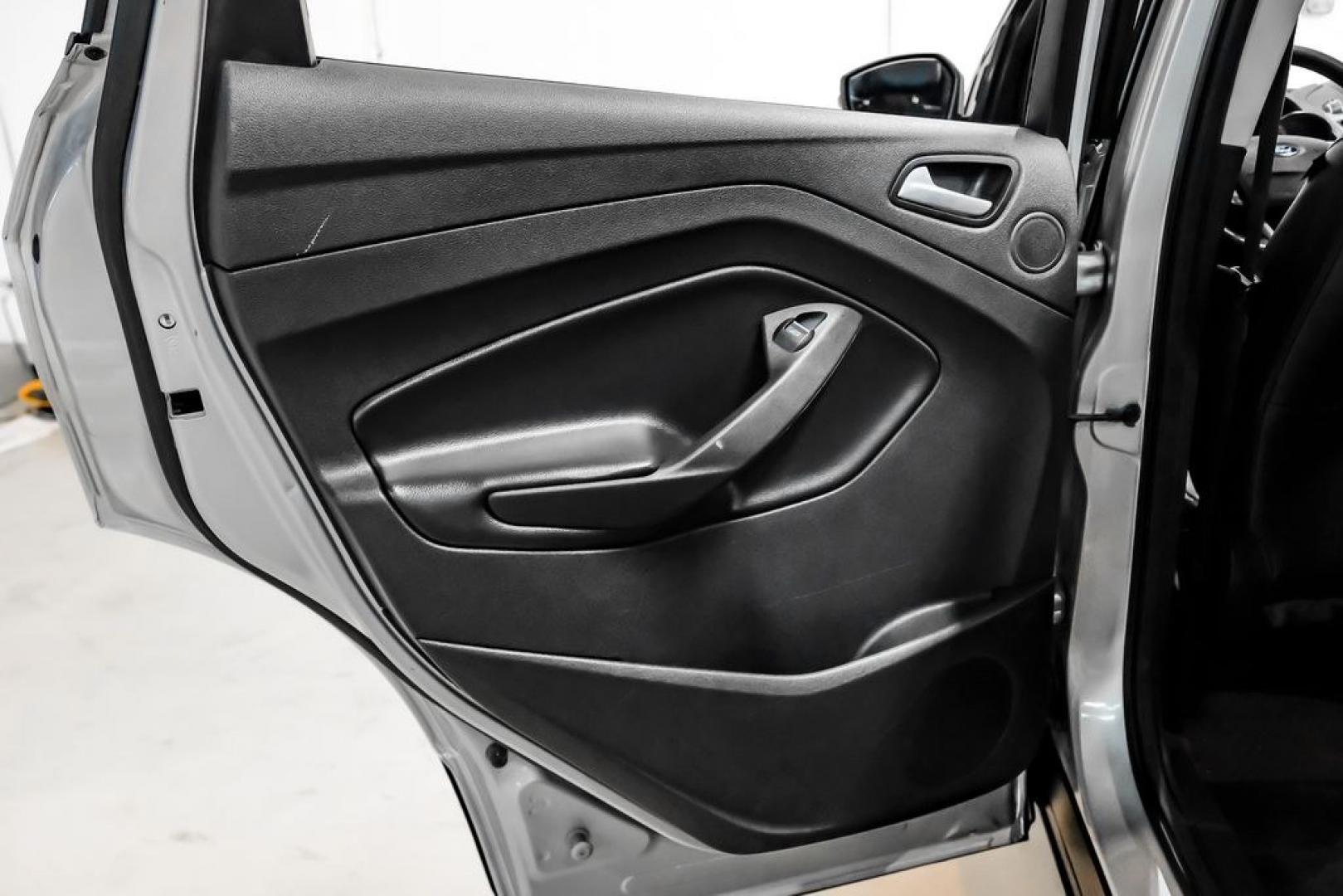 2017 Ingot Silver /Black Ford Escape Titanium (1FMCU0JD8HU) with an 1.5L EcoBoost engine, Automatic transmission, located at 15300 Midway Rd., Addison, TX, 75001, (972) 702-0011, 32.958321, -96.838074- Photo#43