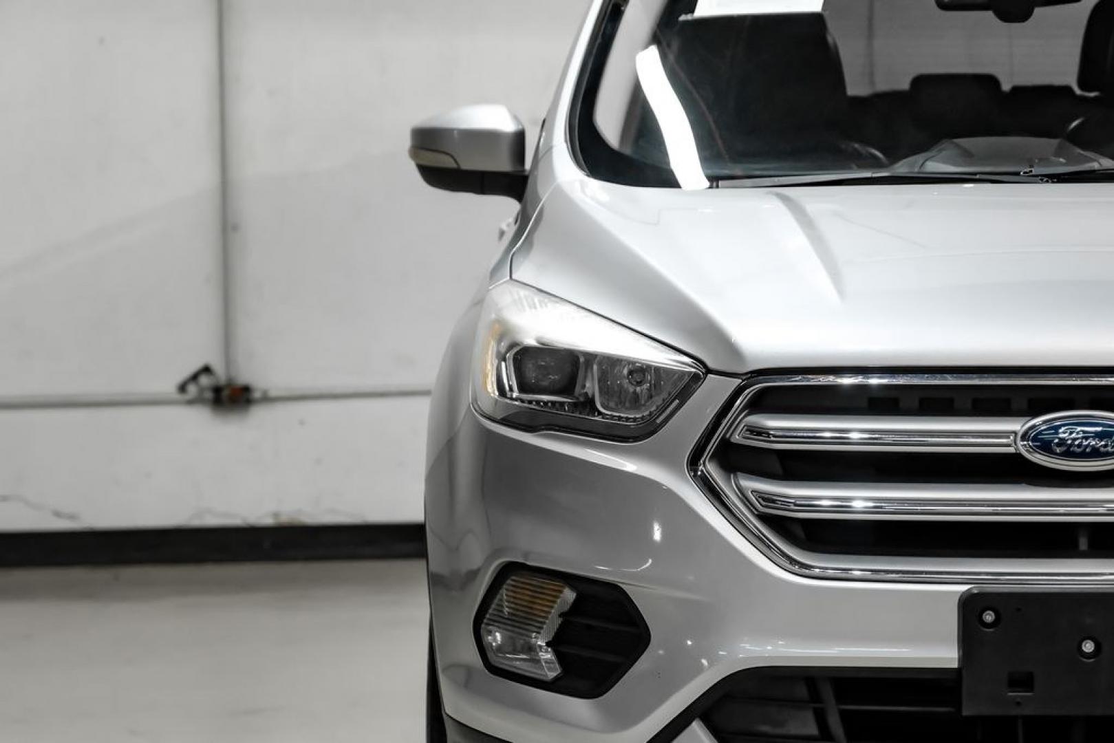 2017 Ingot Silver /Black Ford Escape Titanium (1FMCU0JD8HU) with an 1.5L EcoBoost engine, Automatic transmission, located at 15300 Midway Rd., Addison, TX, 75001, (972) 702-0011, 32.958321, -96.838074- Photo#45