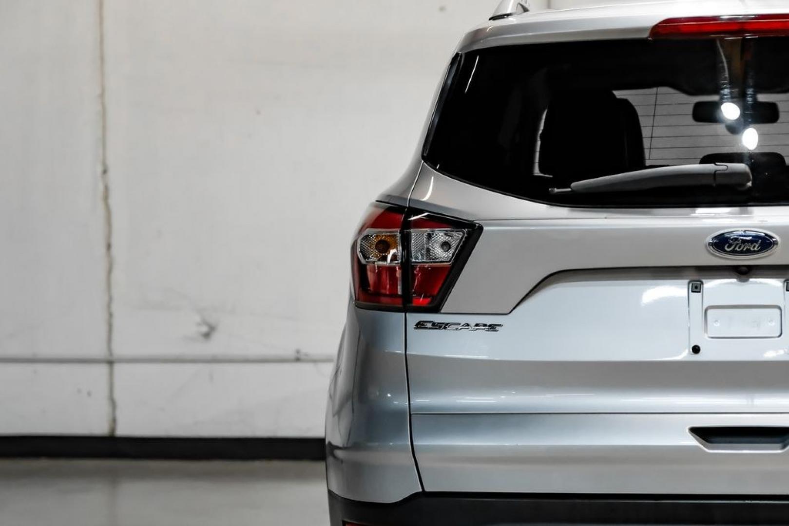 2017 Ingot Silver /Black Ford Escape Titanium (1FMCU0JD8HU) with an 1.5L EcoBoost engine, Automatic transmission, located at 15300 Midway Rd., Addison, TX, 75001, (972) 702-0011, 32.958321, -96.838074- Photo#46
