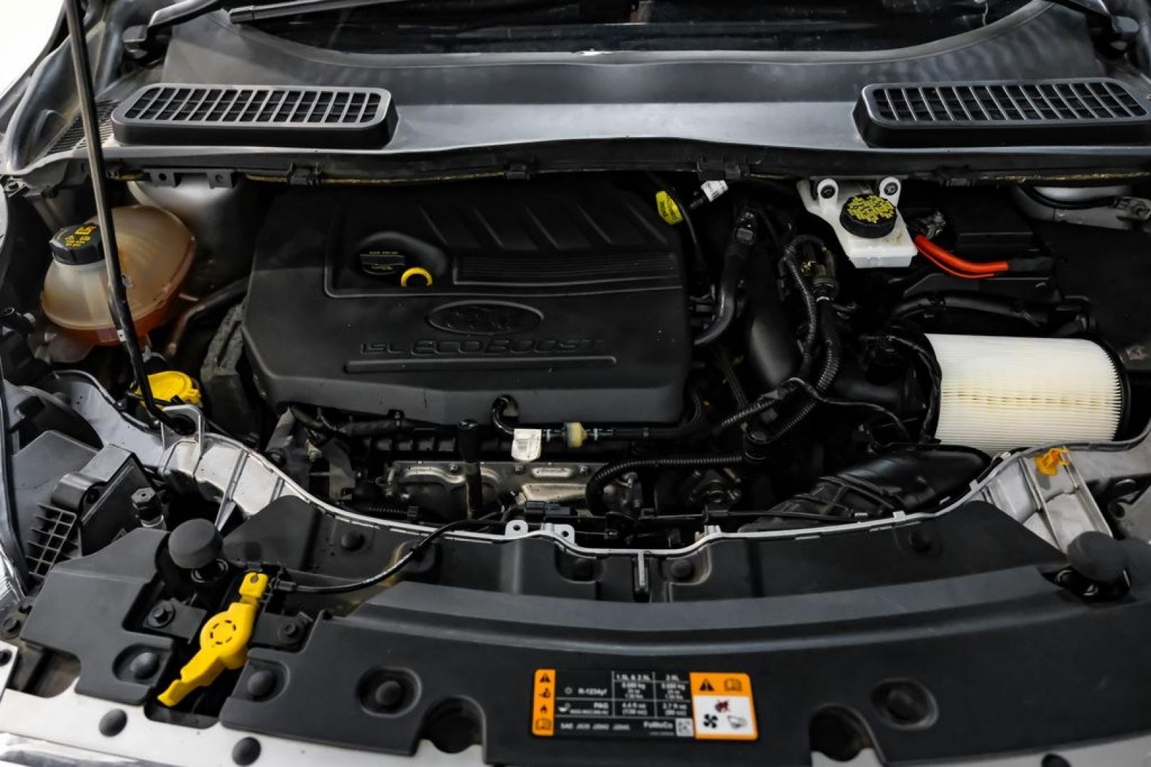 2017 Ingot Silver /Black Ford Escape Titanium (1FMCU0JD8HU) with an 1.5L EcoBoost engine, Automatic transmission, located at 15300 Midway Rd., Addison, TX, 75001, (972) 702-0011, 32.958321, -96.838074- Photo#48