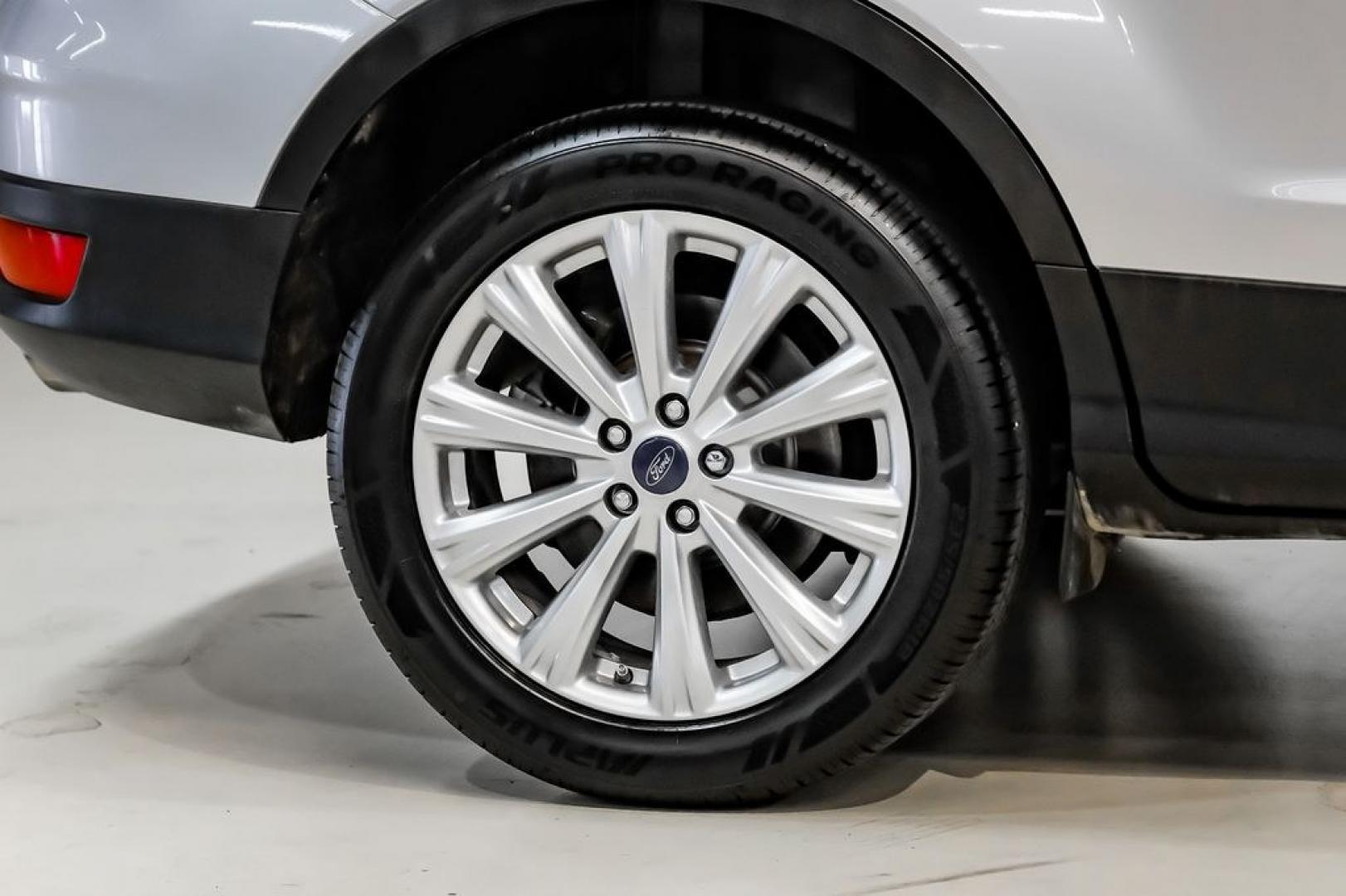 2017 Ingot Silver /Black Ford Escape Titanium (1FMCU0JD8HU) with an 1.5L EcoBoost engine, Automatic transmission, located at 15300 Midway Rd., Addison, TX, 75001, (972) 702-0011, 32.958321, -96.838074- Photo#51