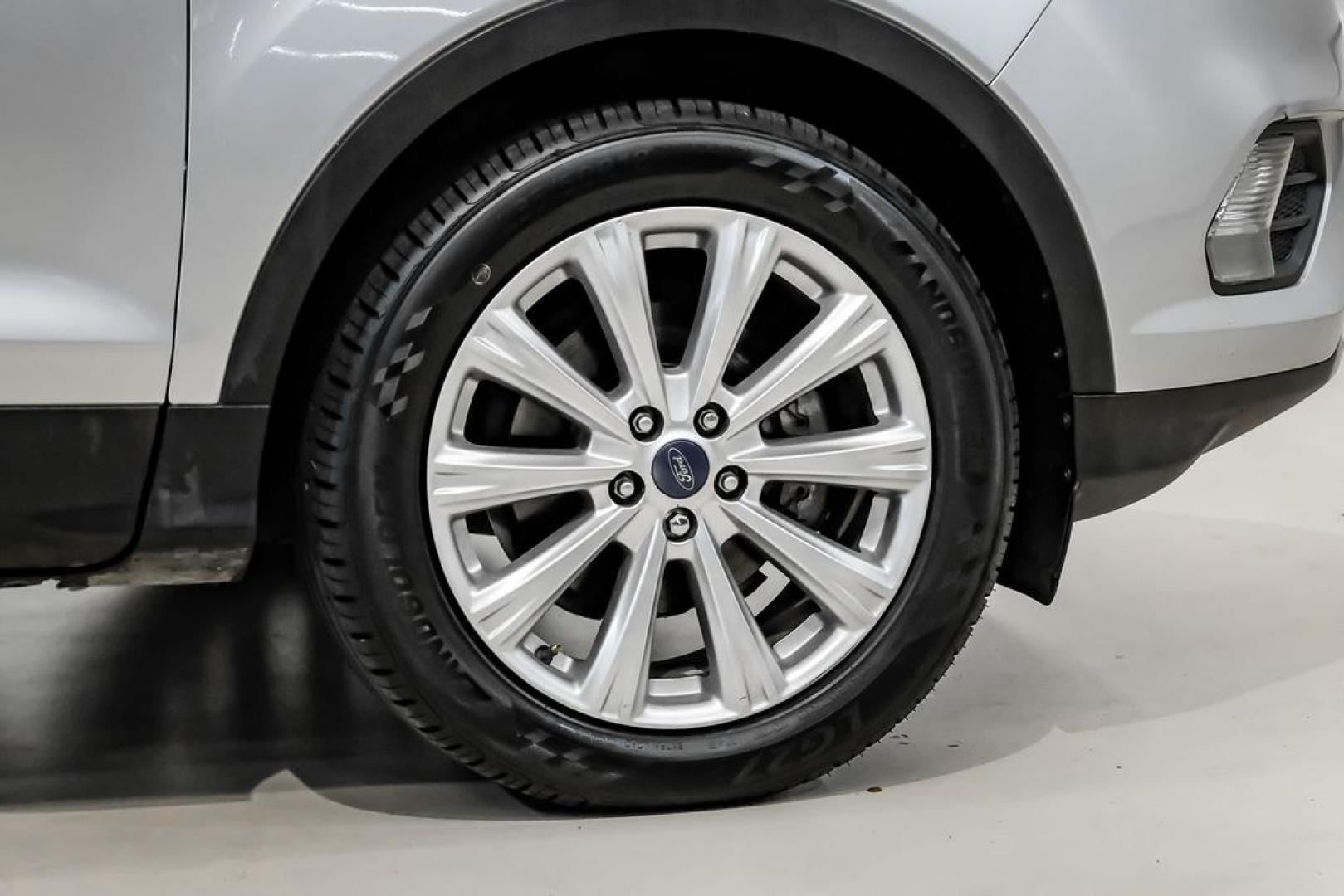 2017 Ingot Silver /Black Ford Escape Titanium (1FMCU0JD8HU) with an 1.5L EcoBoost engine, Automatic transmission, located at 15300 Midway Rd., Addison, TX, 75001, (972) 702-0011, 32.958321, -96.838074- Photo#52