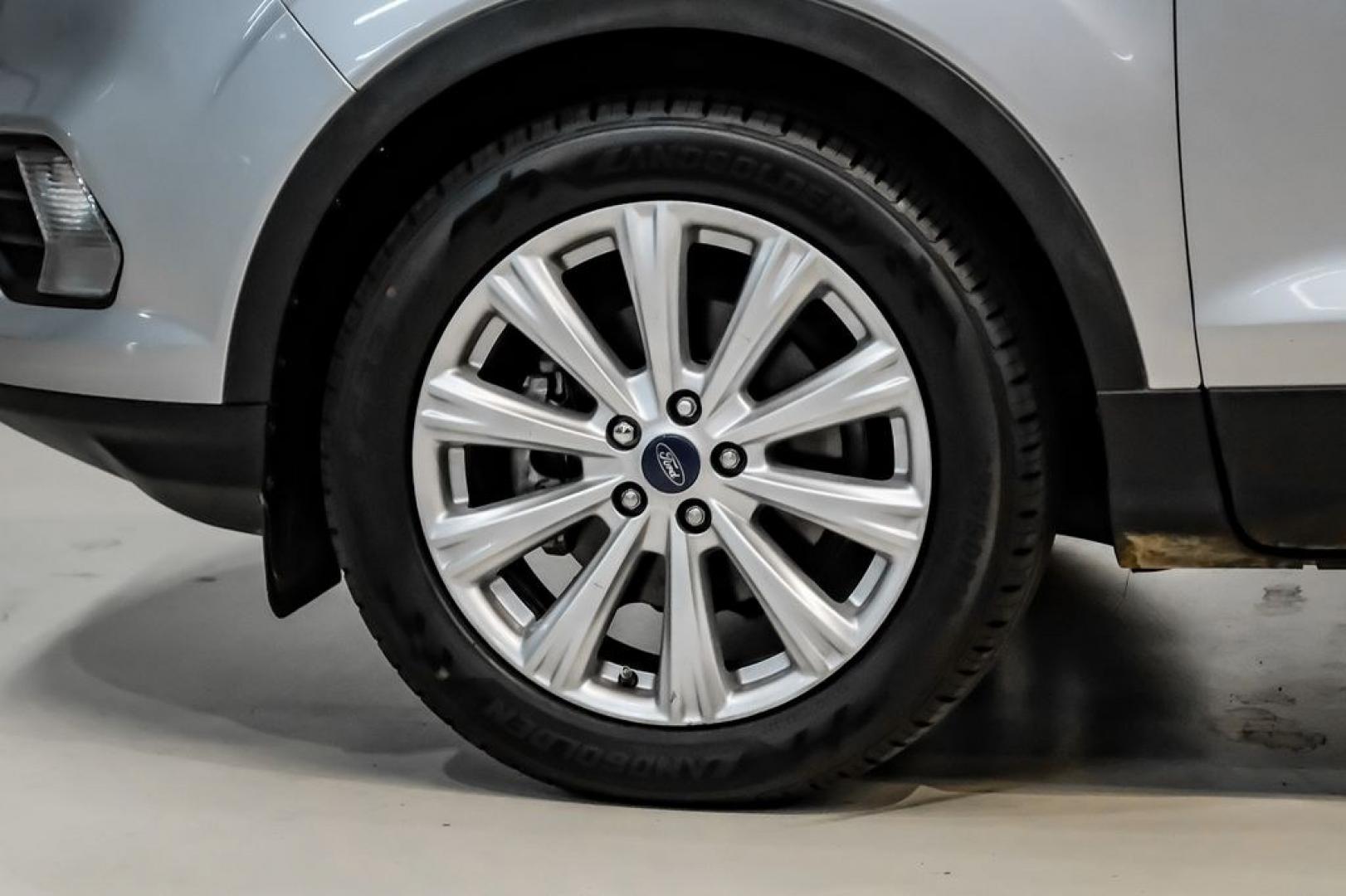 2017 Ingot Silver /Black Ford Escape Titanium (1FMCU0JD8HU) with an 1.5L EcoBoost engine, Automatic transmission, located at 15300 Midway Rd., Addison, TX, 75001, (972) 702-0011, 32.958321, -96.838074- Photo#53