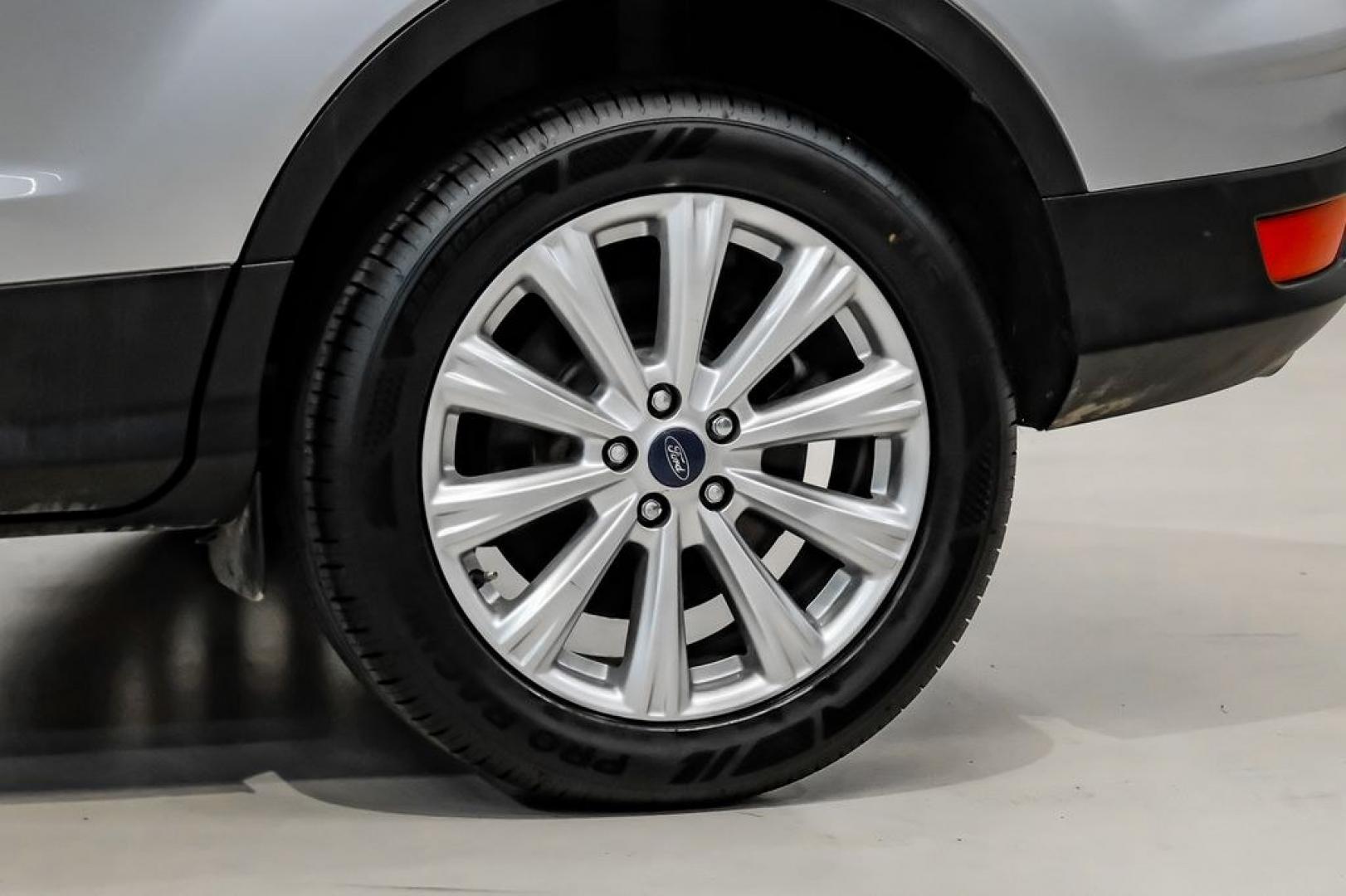 2017 Ingot Silver /Black Ford Escape Titanium (1FMCU0JD8HU) with an 1.5L EcoBoost engine, Automatic transmission, located at 15300 Midway Rd., Addison, TX, 75001, (972) 702-0011, 32.958321, -96.838074- Photo#54